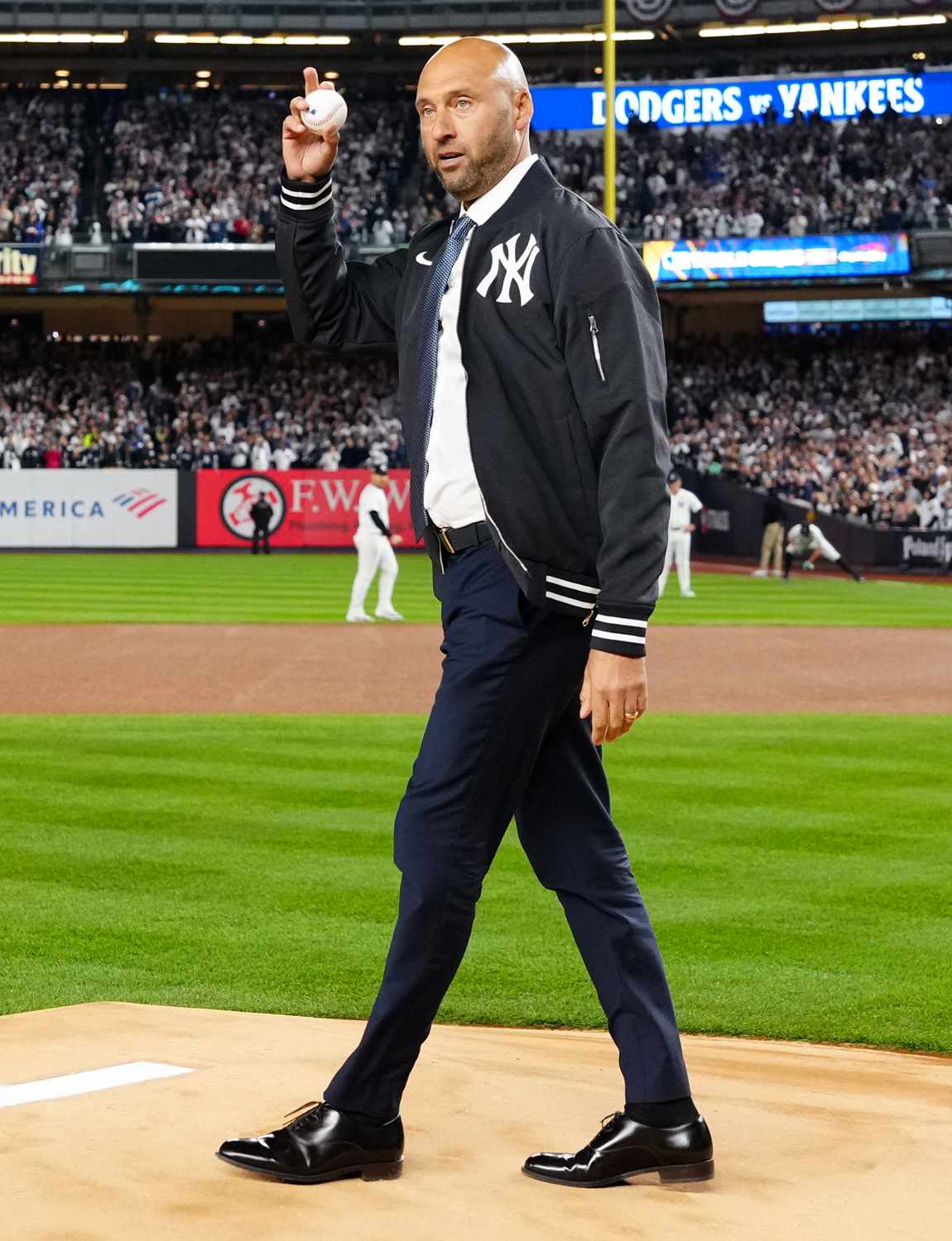 Derek Jeter delivers the ceremonial first pitch prior to Game 3 of the 2024 World Series presented by Capital One 