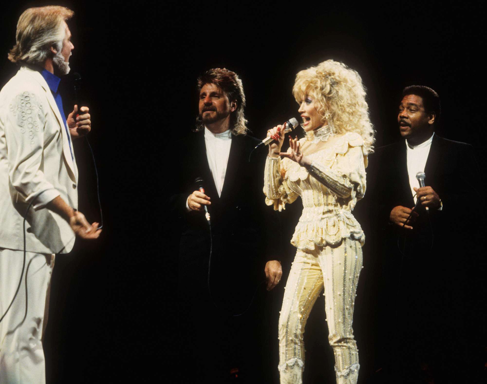 Dolly Parton, and her band with Kenny Rogers perform at the Target Center in Minneapolis, Minnesota on October 29, 1990. 