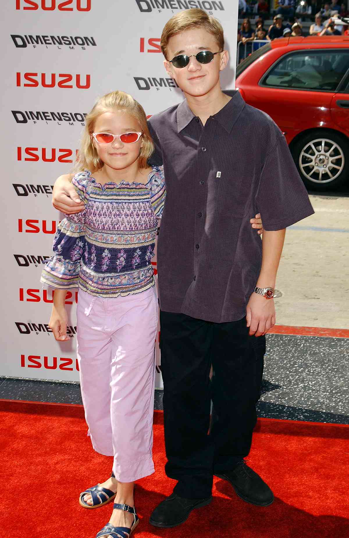 Actor Haley Joel Osment (R) and sister/actress Emily Osment attend the premiere of "Spy Kids 2: The Island of Lost Dreams" at Grauman's Chinese Theatre on July 28, 2002 in Hollywood, California.