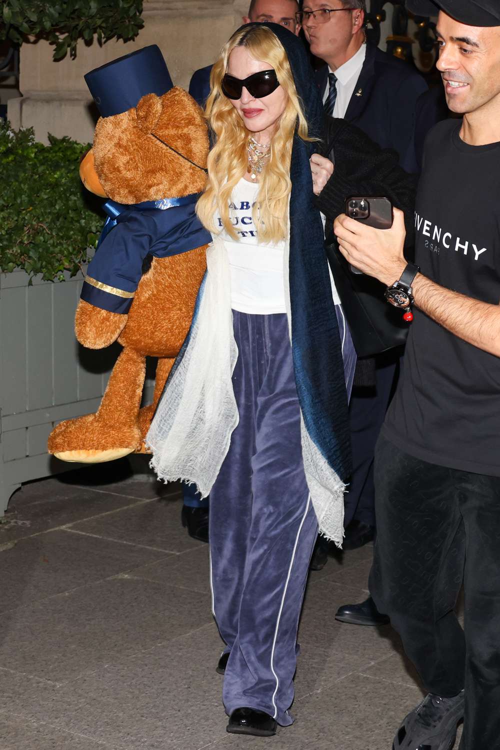 Madonna is seen leaving the Ritz Hotel holding a teddy bear on October 28, 2024 in Paris, France