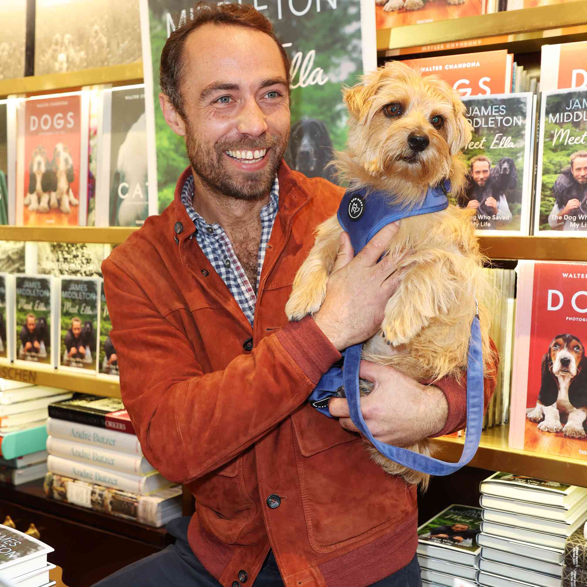 James Middleton poses with a dog at the Taschen Store during Chelsea Dog Day 2024 in support of Pets As Therapy on October 5, 2024 in London, England. 