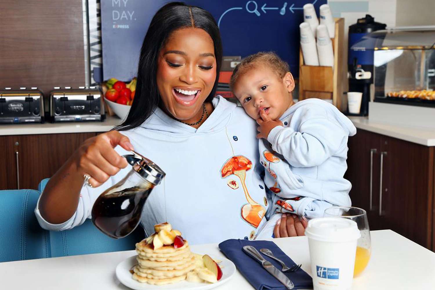 Keke Palmer and her son Leo celebrate National Pancake Day in matching limited-edition Holiday Inn Express x Mr. Eatwell Pancakesuits in New York City on September 18, 2024