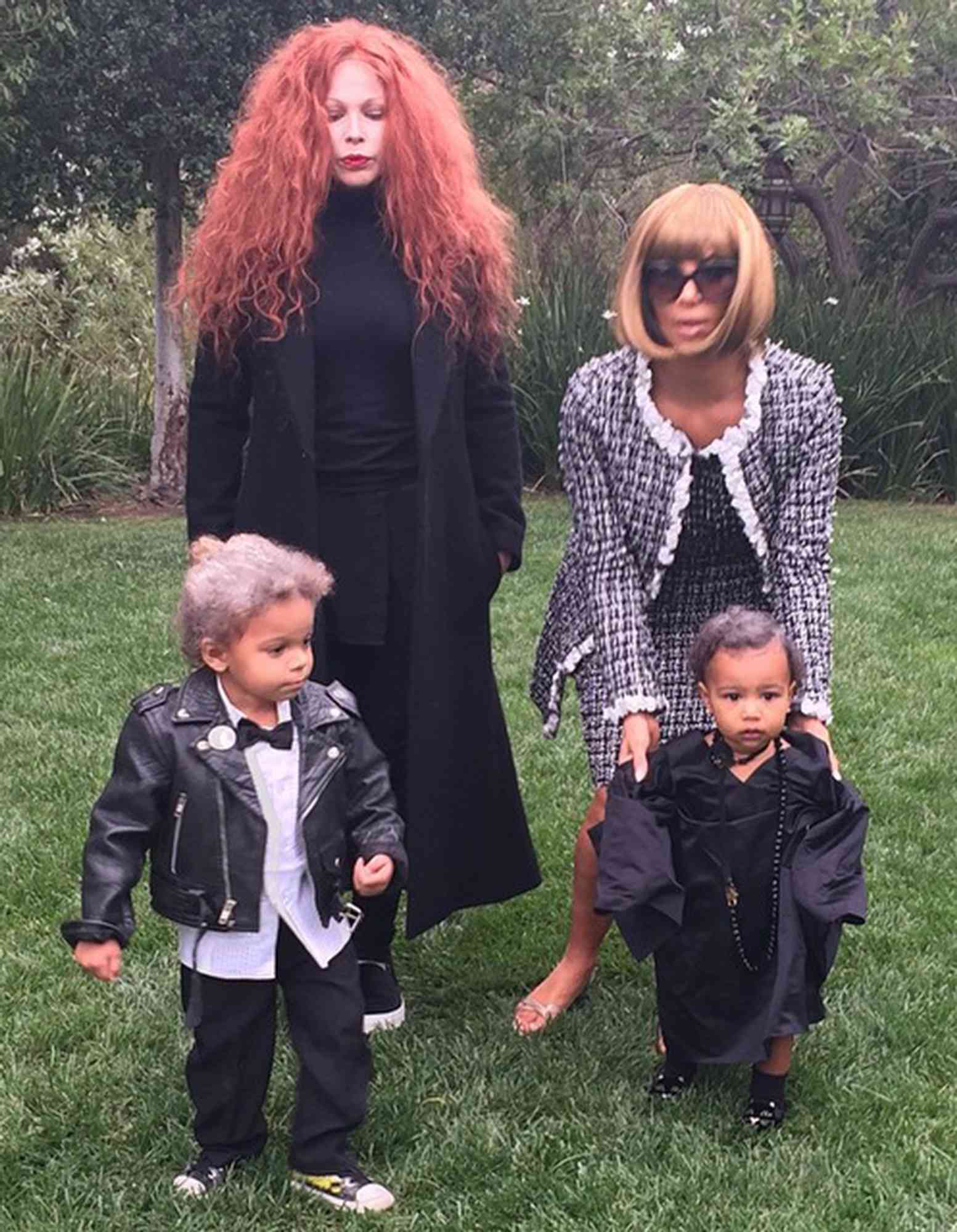 Clockwise from top left: Joyce Bonelli, Kim Kardashian, North West and Zeplin Bonelli gather outside in their 'Vogue'-inspired costumes in 2014