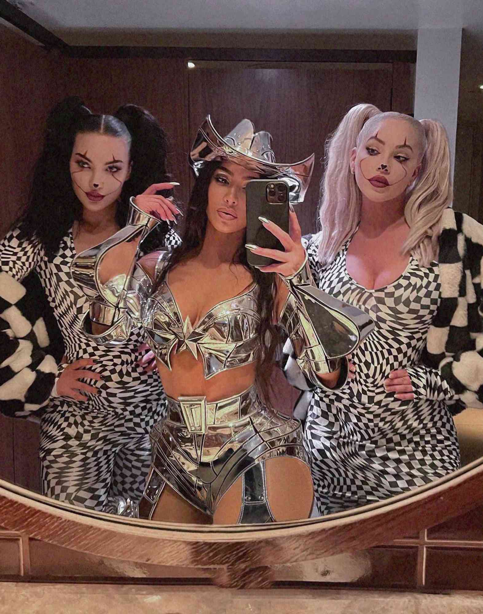 Natalie Halcro, Kim Kardashian and Olivia Pierson pose for a mirror selfie while in costumes