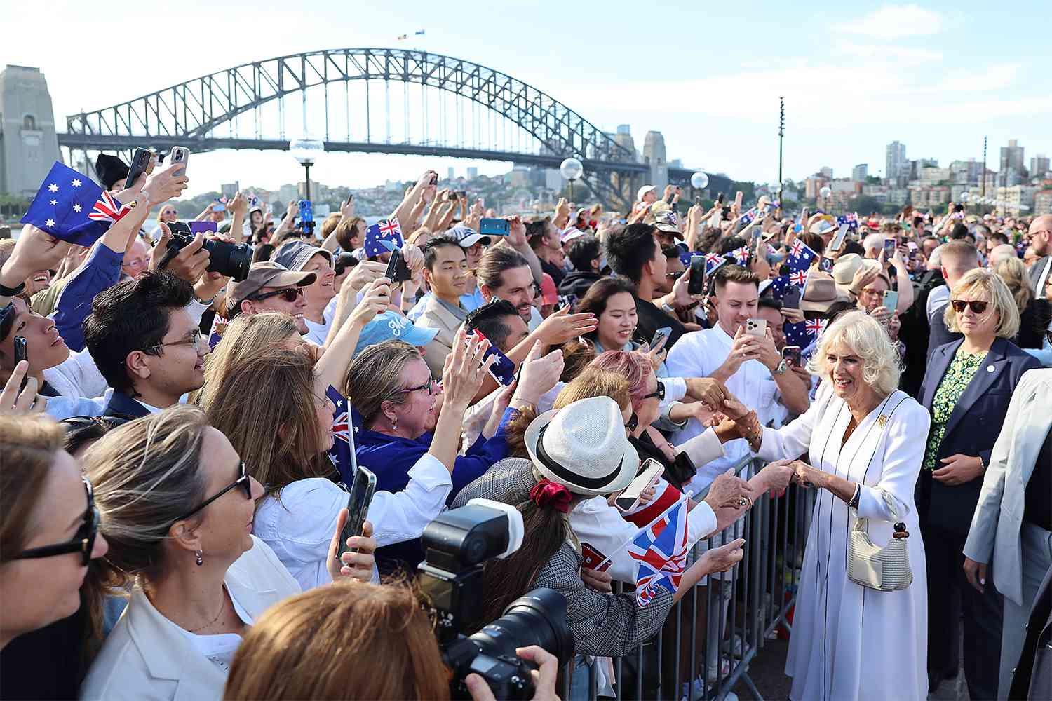 Queen Camilla greets spectators during a visit to the Sydney Opera House on October 22, 2024 in Sydney, Australia.