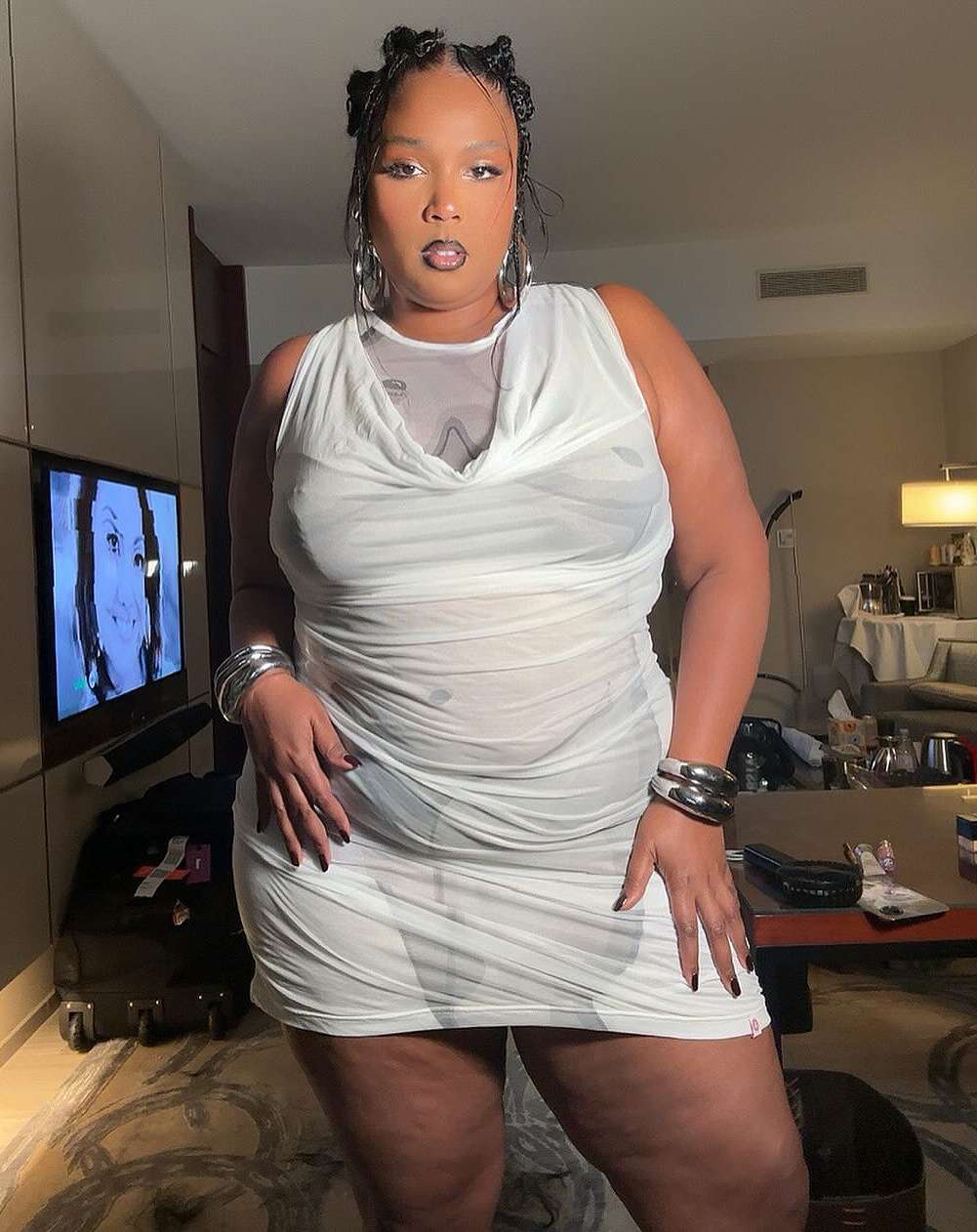 Lizzo in white dress.