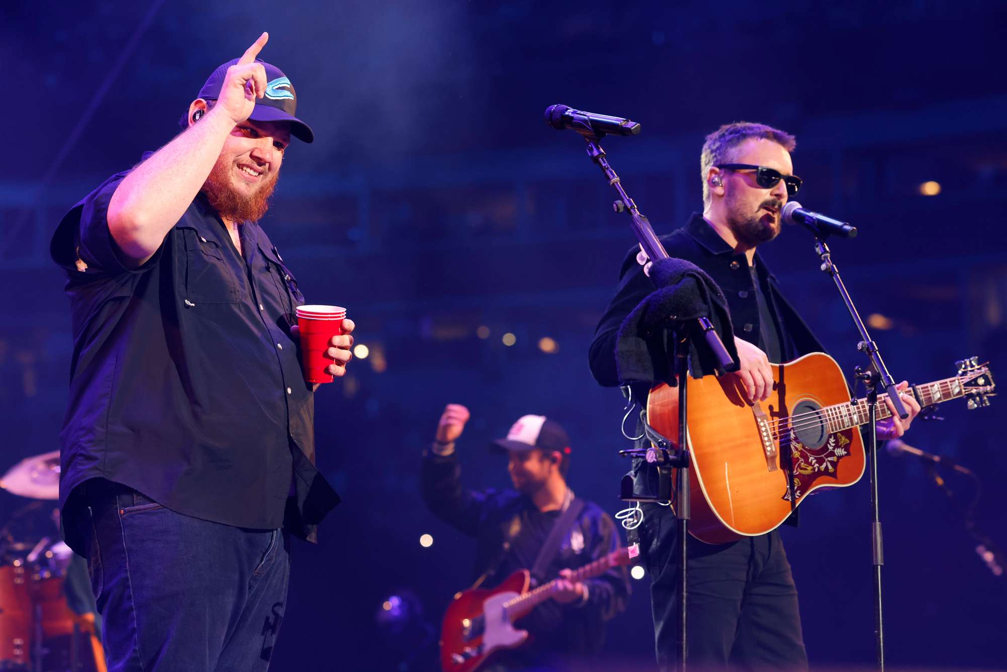 Luke Combs and Eric Church perform onstage at the Concert For Carolina Benefit Concert at Bank of America Stadium on October 26, 2024 in Charlotte, North Carolina. 