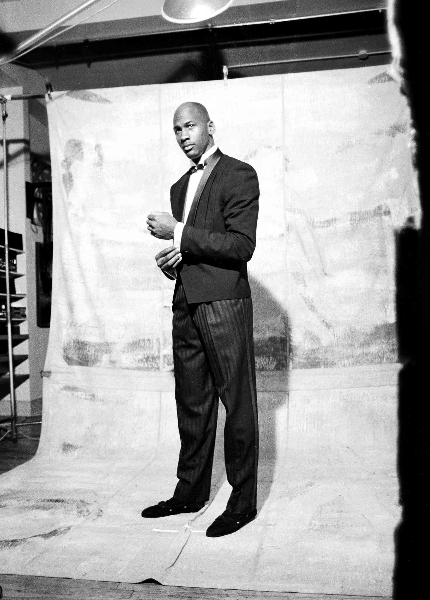 View of American basketball player Micheal Jordan as he poses, modeling samples from a line of formalwear, during a photo shoot, Chicago, Illinois, October 31, 1990.