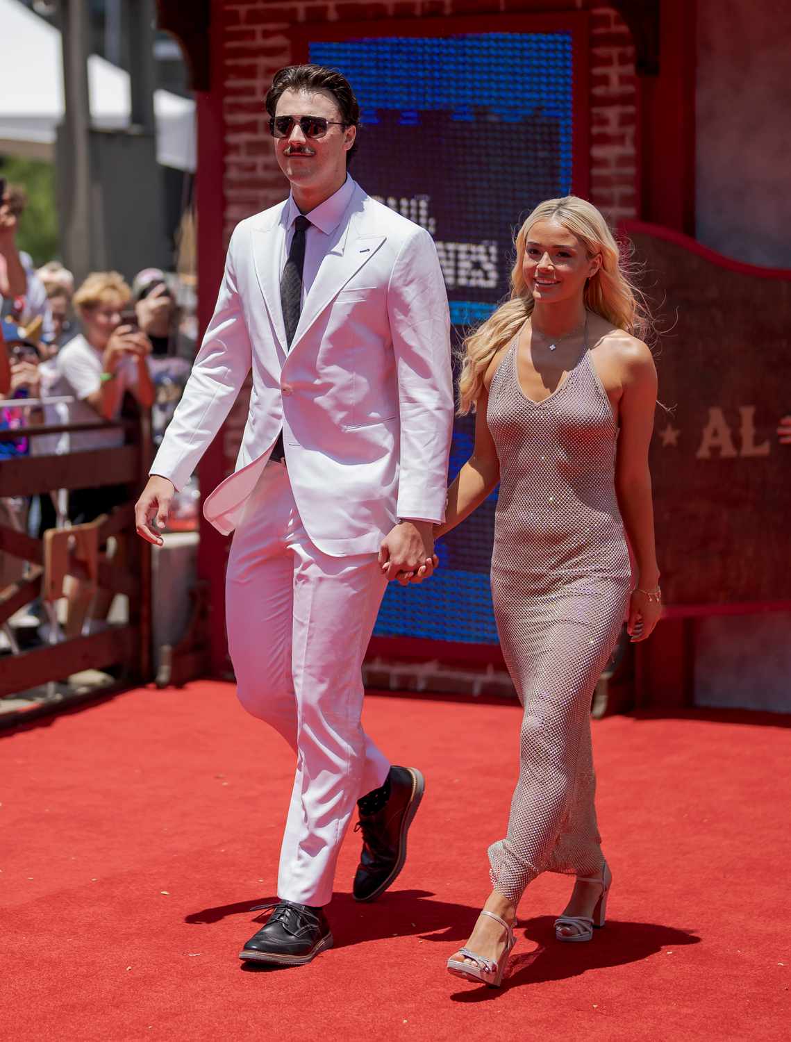 Paul Skenes #30 of the Pittsburgh Pirates, and Livvy Dunne pose for a photo during the 2024 All-Star Red Carpet Show presented by Frutitas Agua Fresca at Globe Life Field North Plaza on Tuesday, July 16, 2024 in Arlington, Texas.