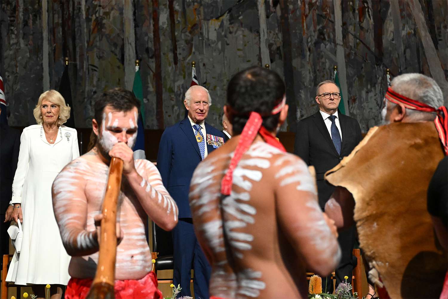 Queen Camilla, King Charles III and Prime Minister of Australia Anthony Albanese observe an Indigenous performance during a Parliamentary reception hosted by Prime Minister of Australia Anthony Albanese and Jodie Haydon on October 21, 2024 in Canberra, Australia. 