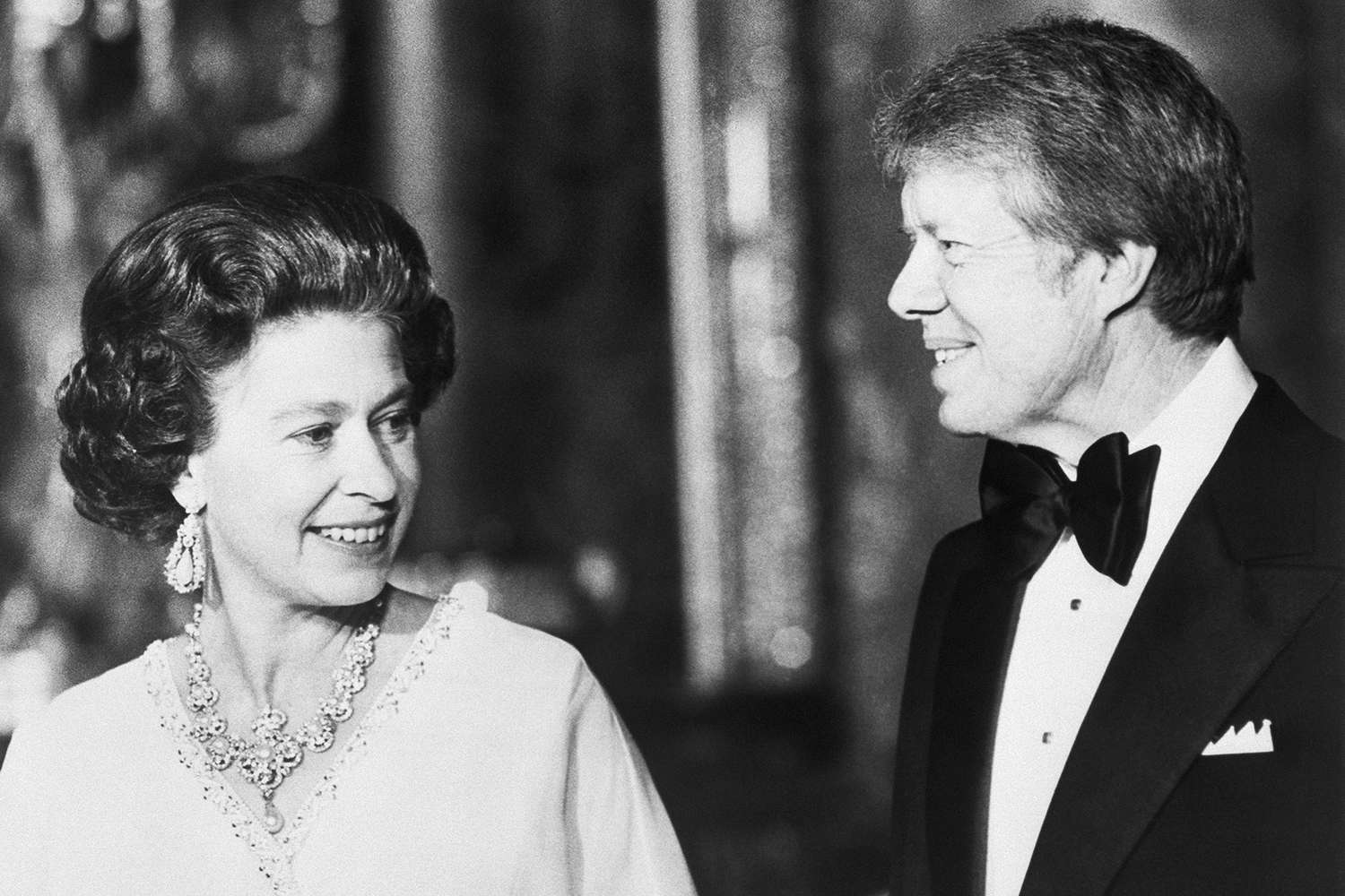 President Jimmy Carter stands with Queen Elizabeth at Buckingham Palace, at a dinner for summit leaders.