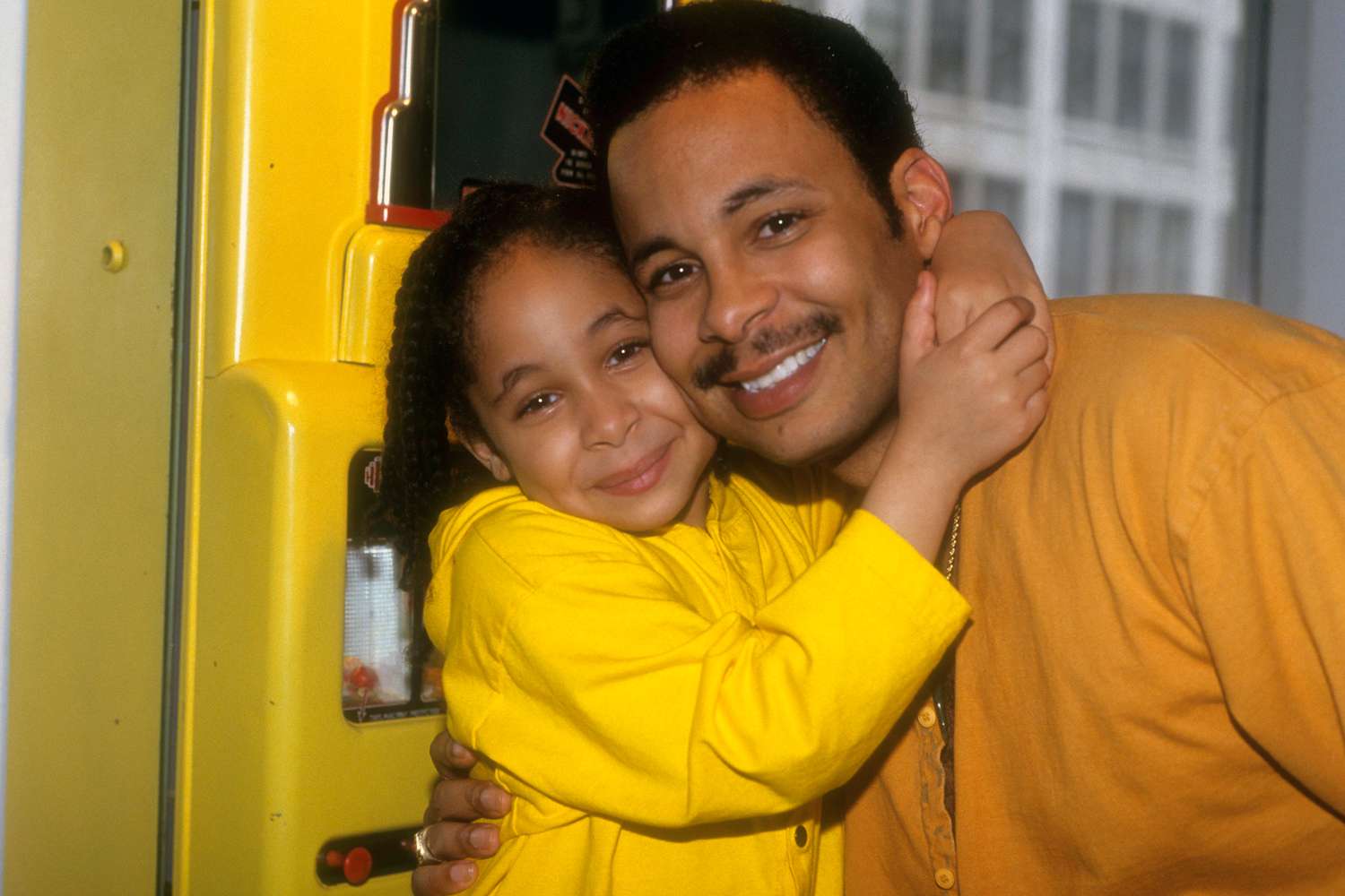 Seven-year-old Raven-Symone records her "Here's To New Dreams" album and CD at Soundtracks Studios and gives her father a hug on May 15, 1992 in New York City