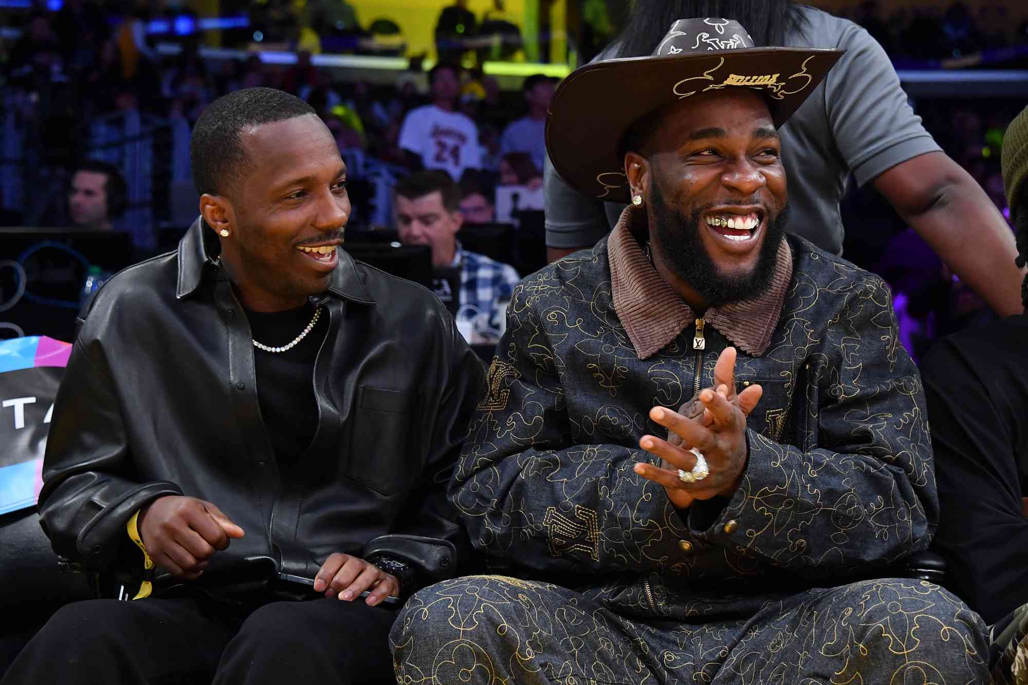 Rich Paul and Burna Boy attend a basketball game between the Los Angeles Lakers and the Sacramento Kings at Crypto.com Arena on October 26, 2024 in Los Angeles, California.