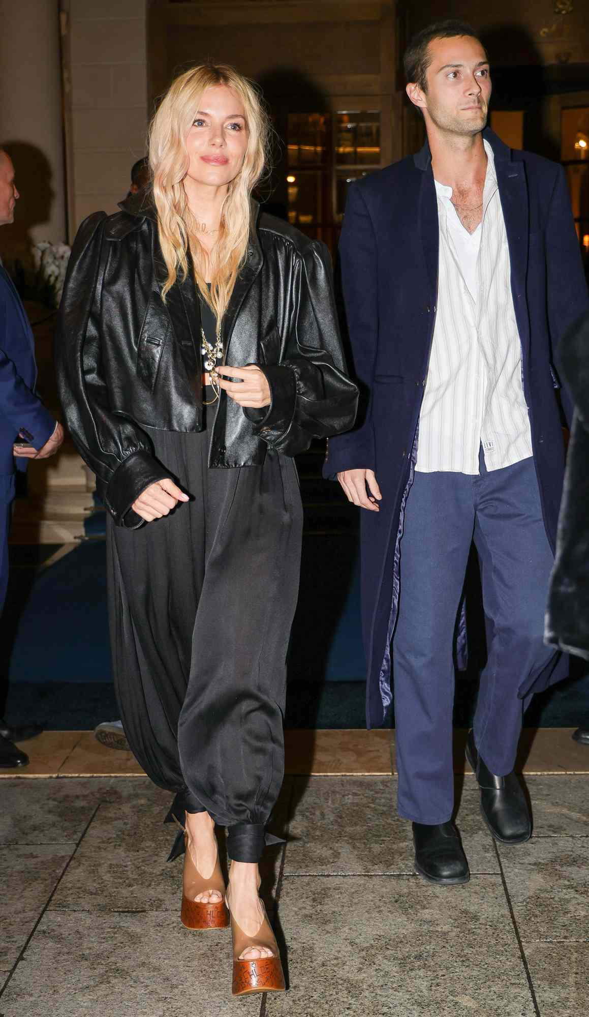 Sienna Miller and Oli Green leave their hotel in style during Paris fashion week.