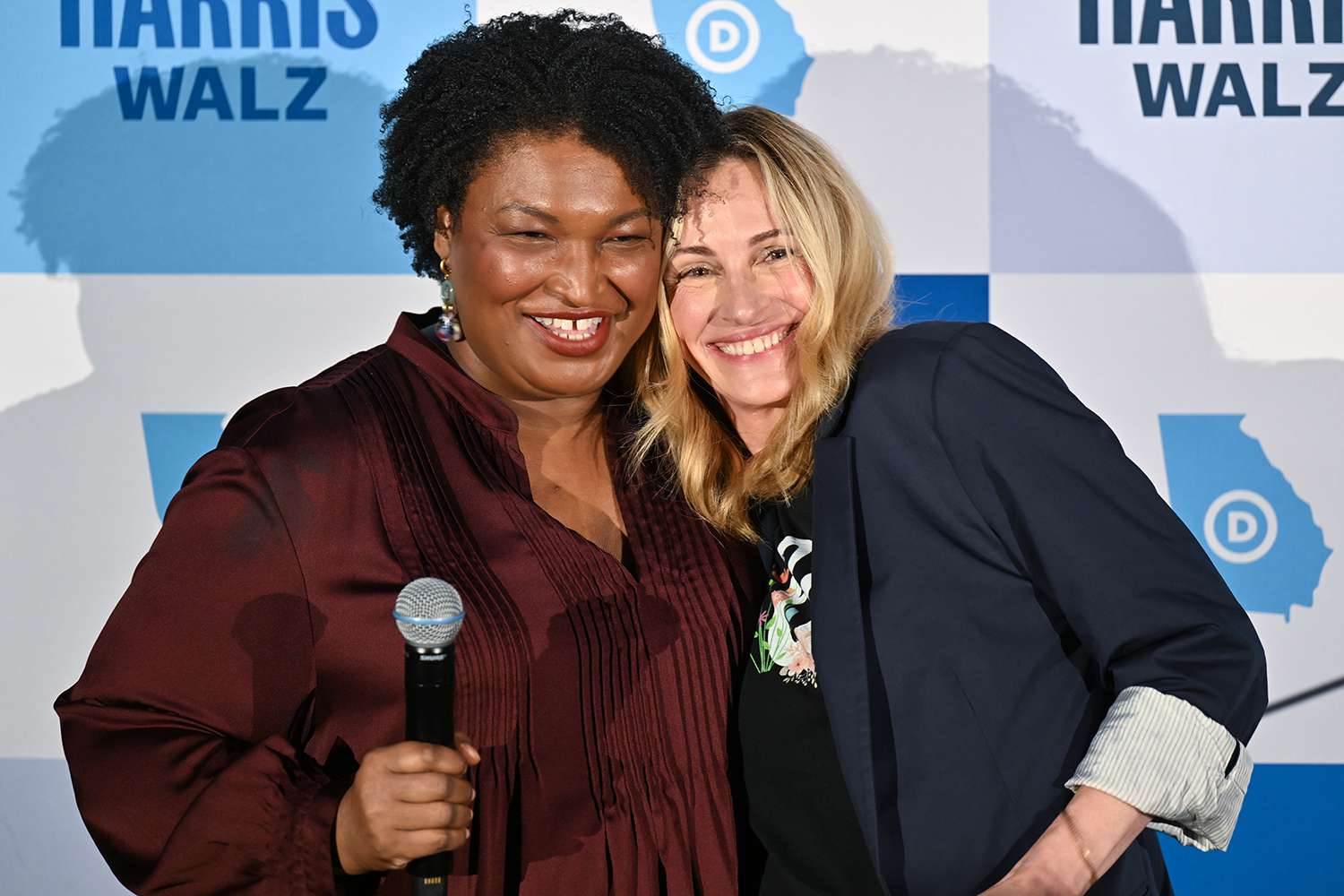 Stacey Abrams and Julia Roberts are seen on stage during the Cherokee County Reproductive Freedom Rally 