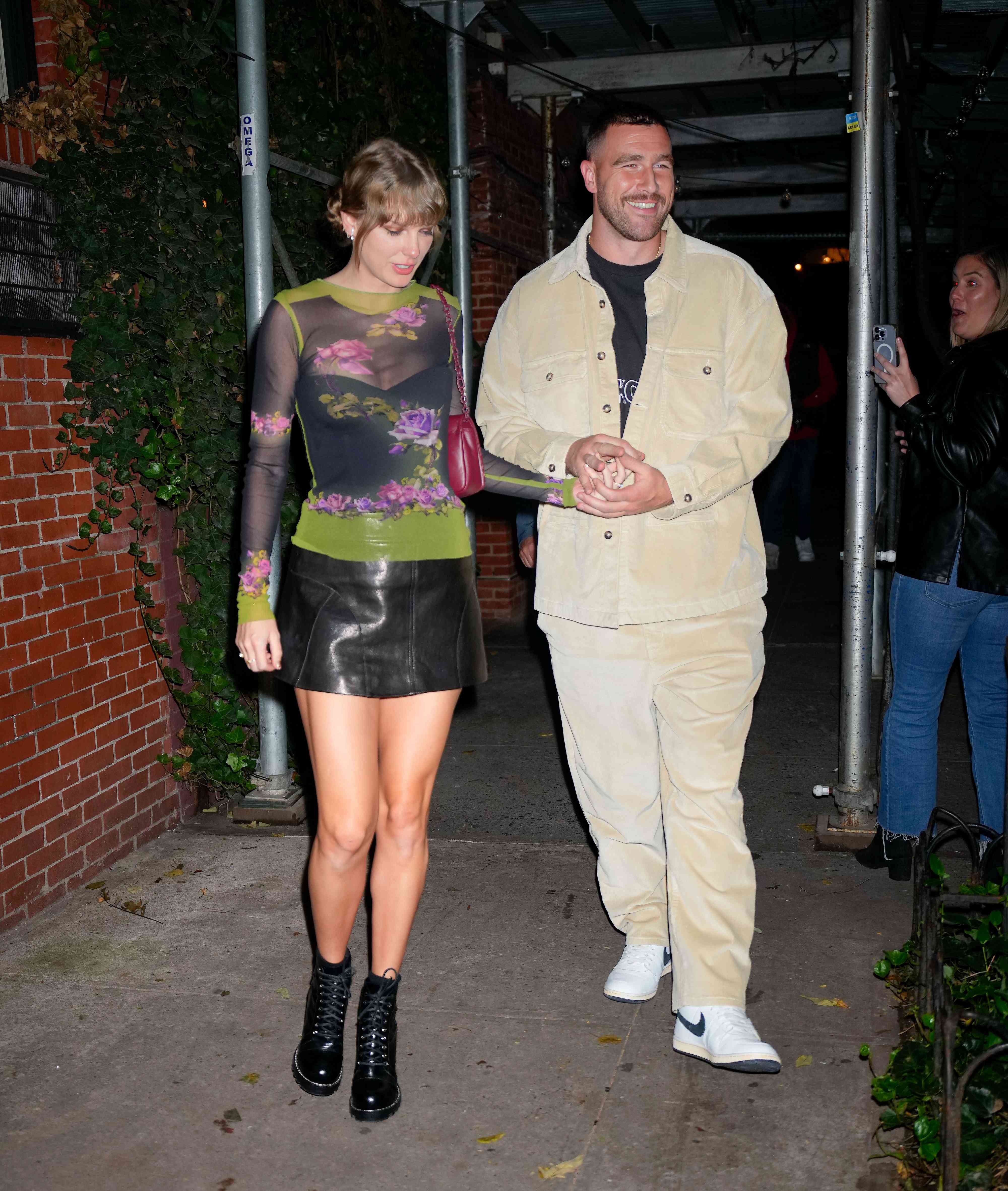 Taylor Swift (left) and Travis Kelce in New York City in October 2023