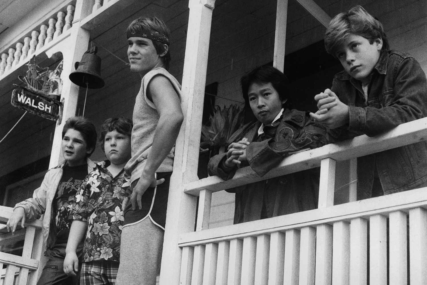 From left to right, Corey Feldman, Jeff Cohen, Josh Brolin, Ke Huy Quand and Sean Astin standing on porch in a scene from the film 'Goonies', 1985. 