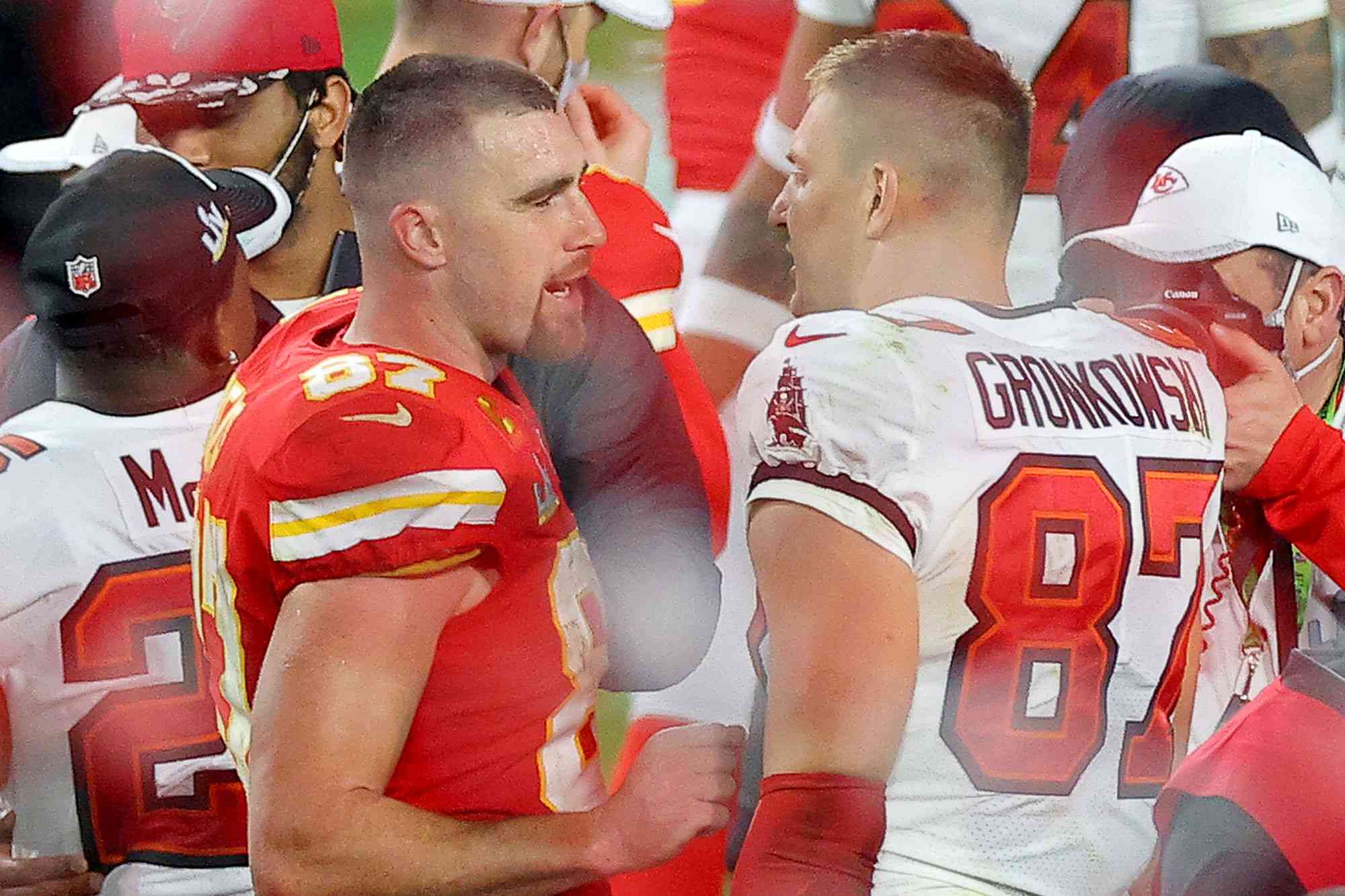 Travis Kelce of the Kansas City Chiefs and Rob Gronkowski #87 of the Tampa Bay Buccaneers speak after Super Bowl LV at Raymond James Stadium on February 07, 2021 