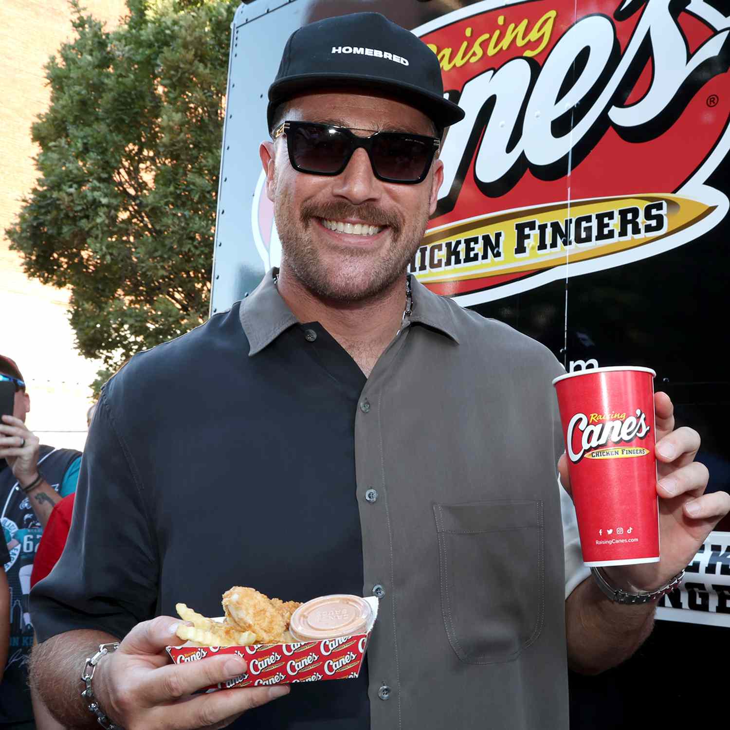 Travis Kelce serves up Raising Cane's at 2nd Annual Kelce Car Jam 