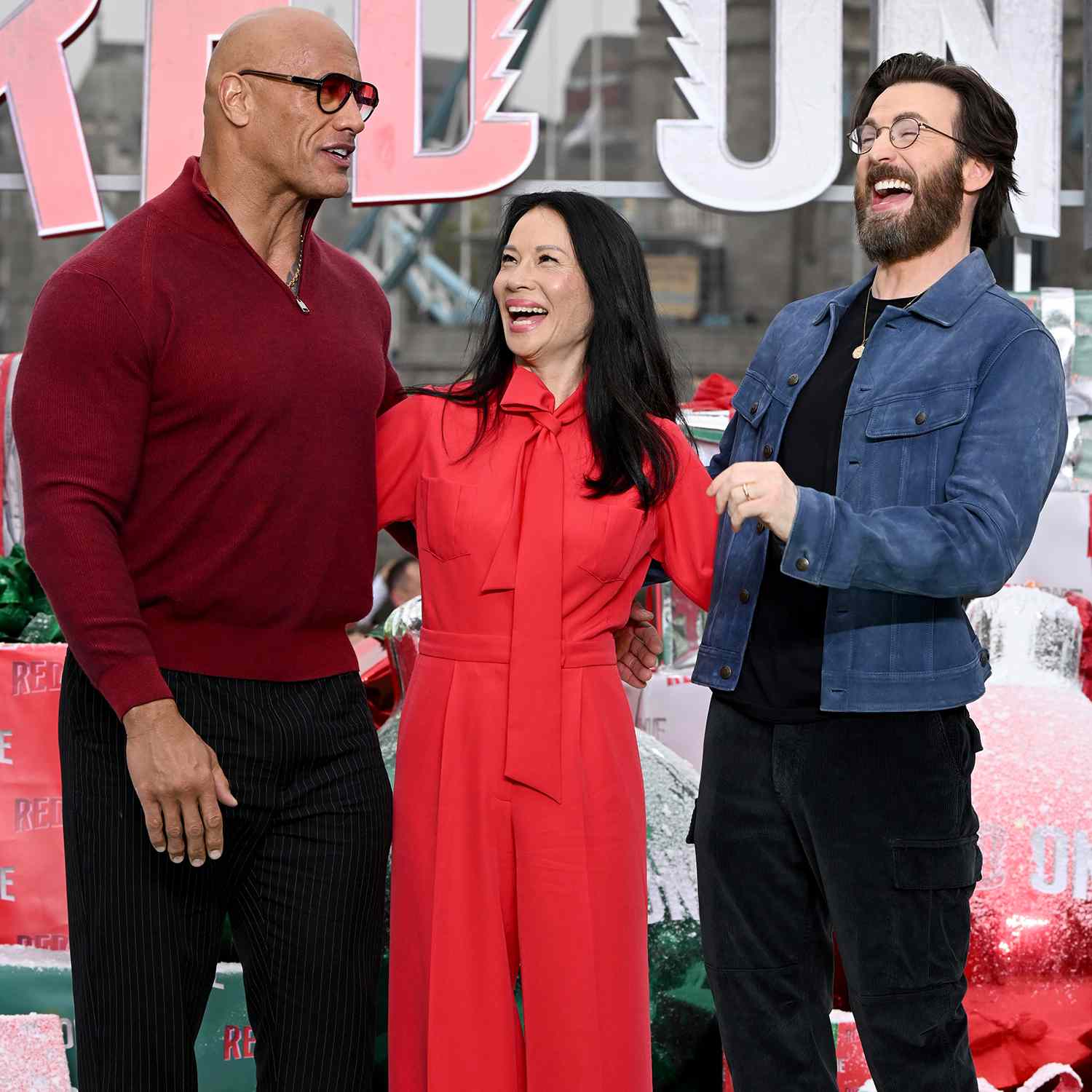 Dwayne Johnson aka The Rock, Lucy Liu and Chris Evans london 11 06 24