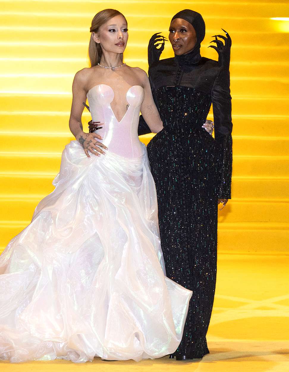 Ariana Grande and Cynthia Erivo pose on the yellow carpet "Wicked: Part One" at Auditorio Nacional on November 11, 2024 in Mexico City, Mexico.