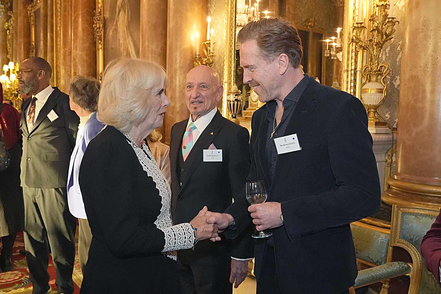 Queen Camilla with Damien Lewis during a reception to mark the centenary of the Film and TV charity, at Buckingham Palace on November 13, 2024 in London, England. The Film and TV Charity was founded in 1924 as the Cinematograph Trade Benevolent Fund to help people working in the screen industries to overcome a spectrum of personal and professional challenges. The King became Patron of the Film and Television Charity succeeding Queen Elizabeth II, who had held the patronage since 1952.