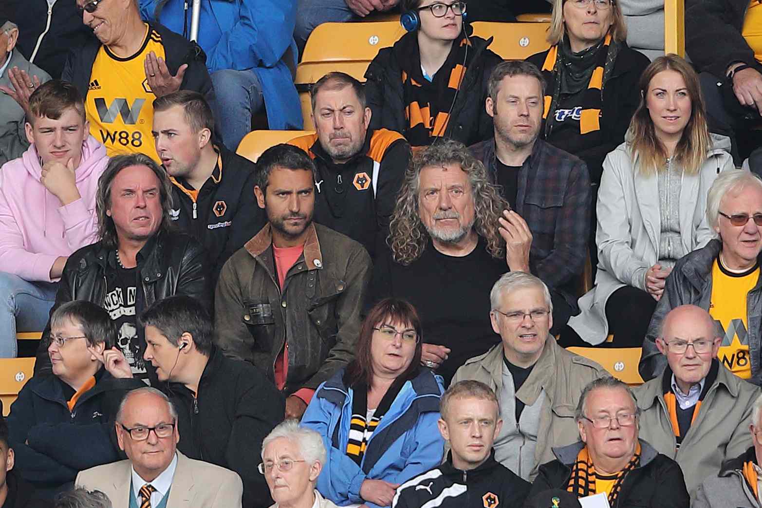 Former Led Zeppelin lead singer Robert Plant sits next to his son Logan Plant during the Premier League match between Wolverhampton Wanderers and Manchester City at Molineux on August 25, 2018 in Wolverhampton, UK.