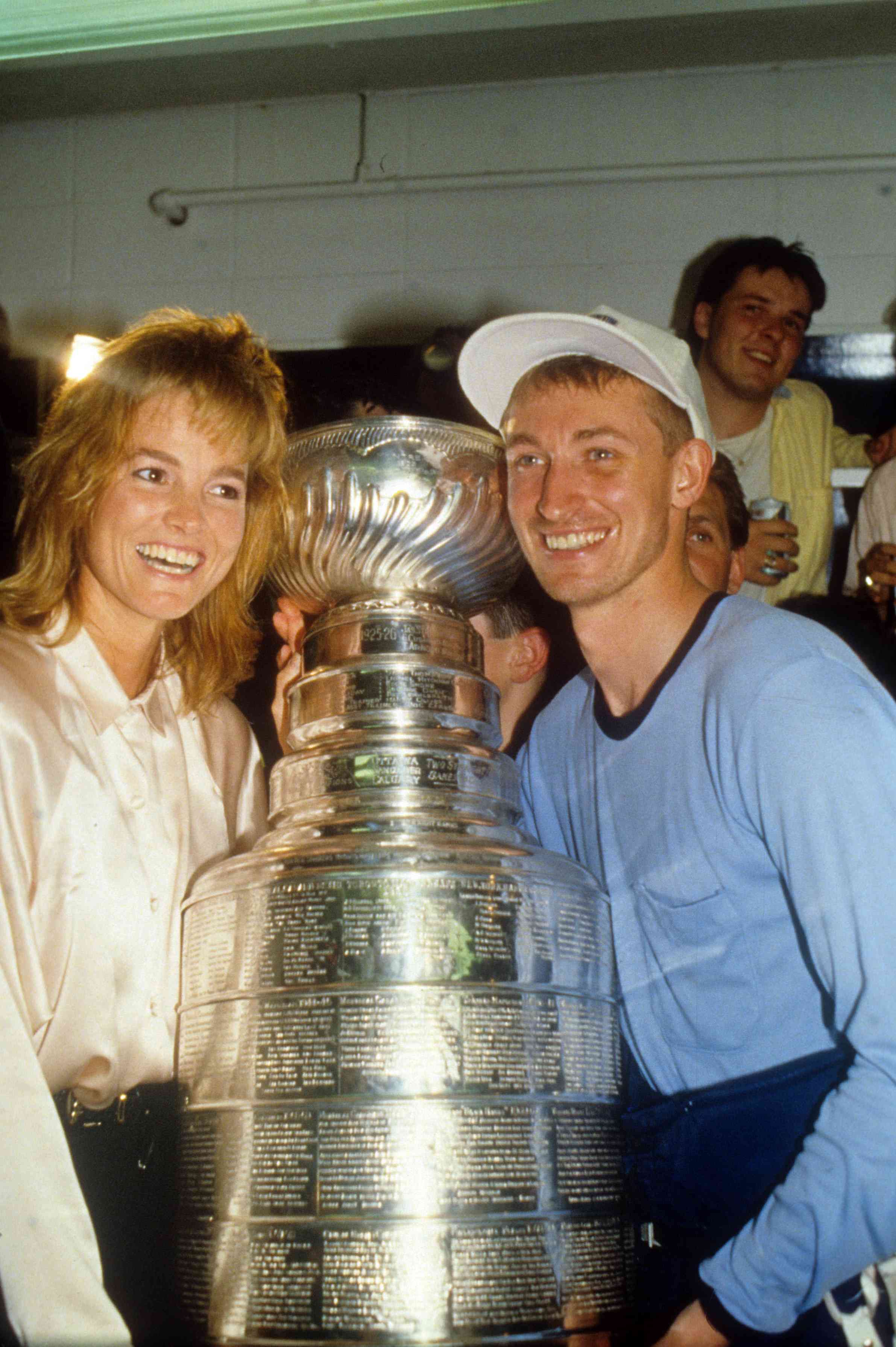 Wayne Gretzky #99 of the Edmonton Oilers and wife Janet Jones celebrate after the Edmonton Oilers defeated the Boston Bruins in Game 5 of the 1988 Stanley Cup Finals on May 26, 1988 at the Northlands Coliseum in Edmonton, Alberta, Canada.