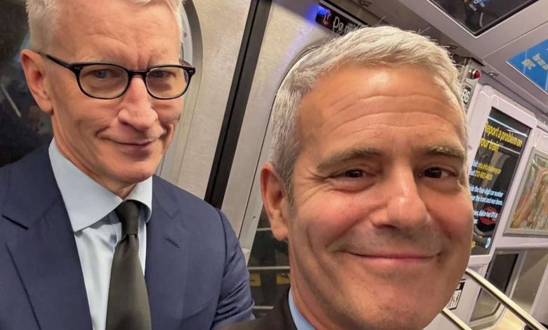 Anderson Cooper Grouchily Takes the Subway with Andy Cohen and Snaps a Selfie: 'You Weren't Attracting Enough Attention?'