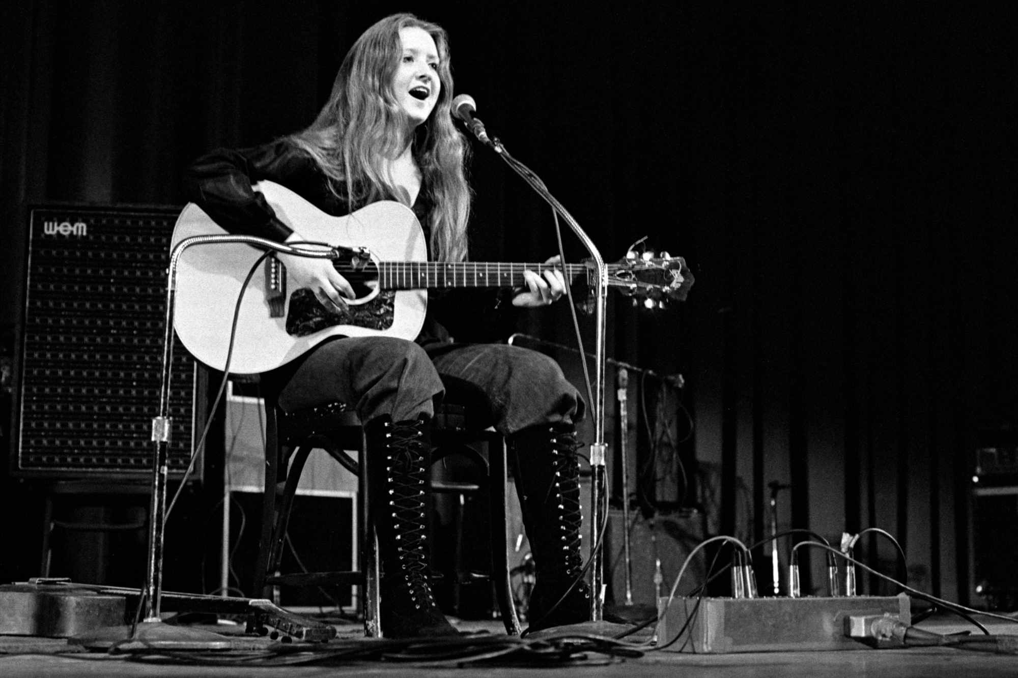 Bonnie Raitt performing as the opening act for The Byrds during a concert at Queens College in New York.