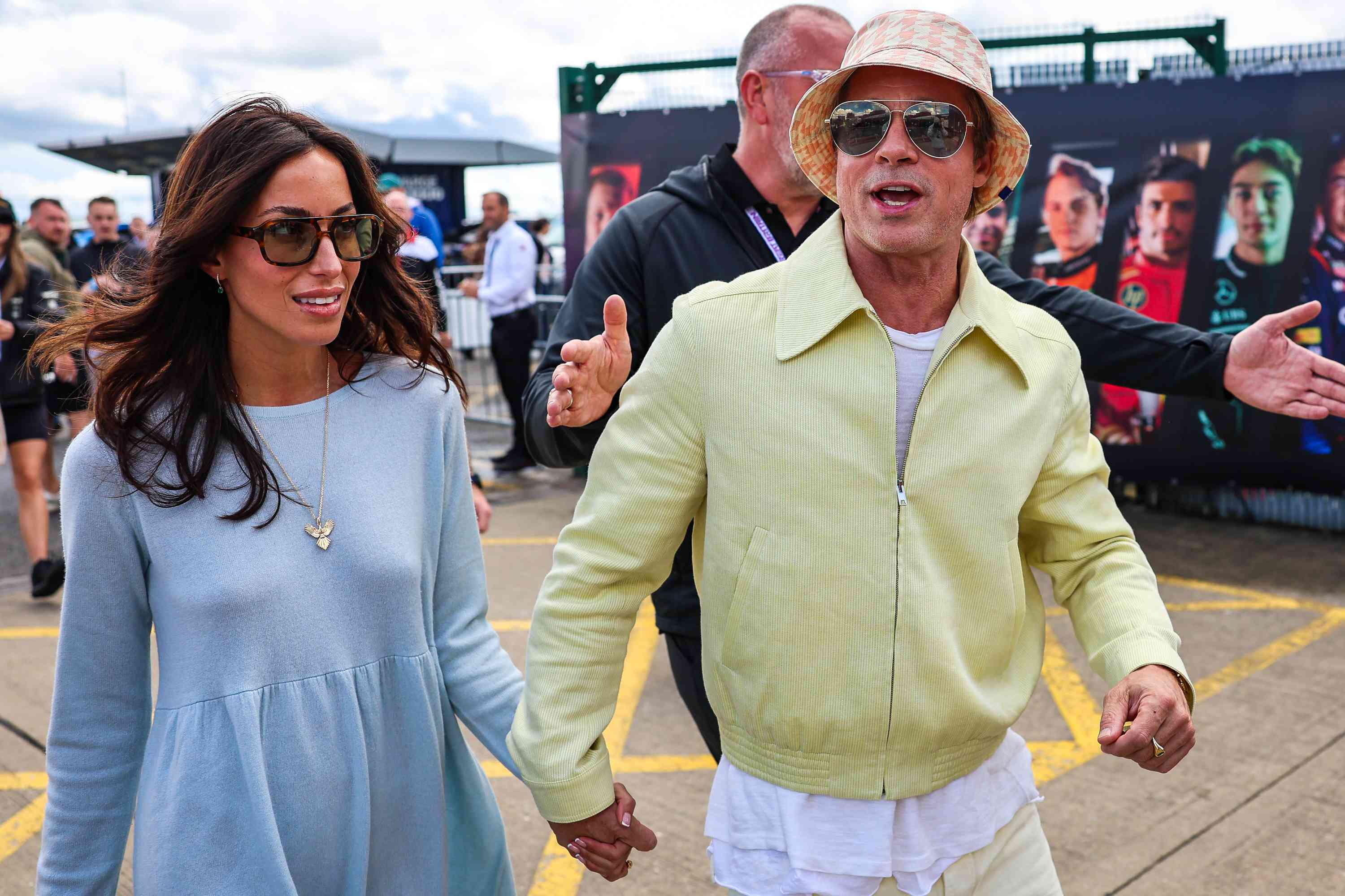 Brad Pitt, star of upcoming 'F1' movie, arrives in the paddock with girlfriend Ines de Ramon during the F1 Grand Prix of Great Britain at Silverstone Circuit on July 7, 2024 in Northampton, United Kingdom. 