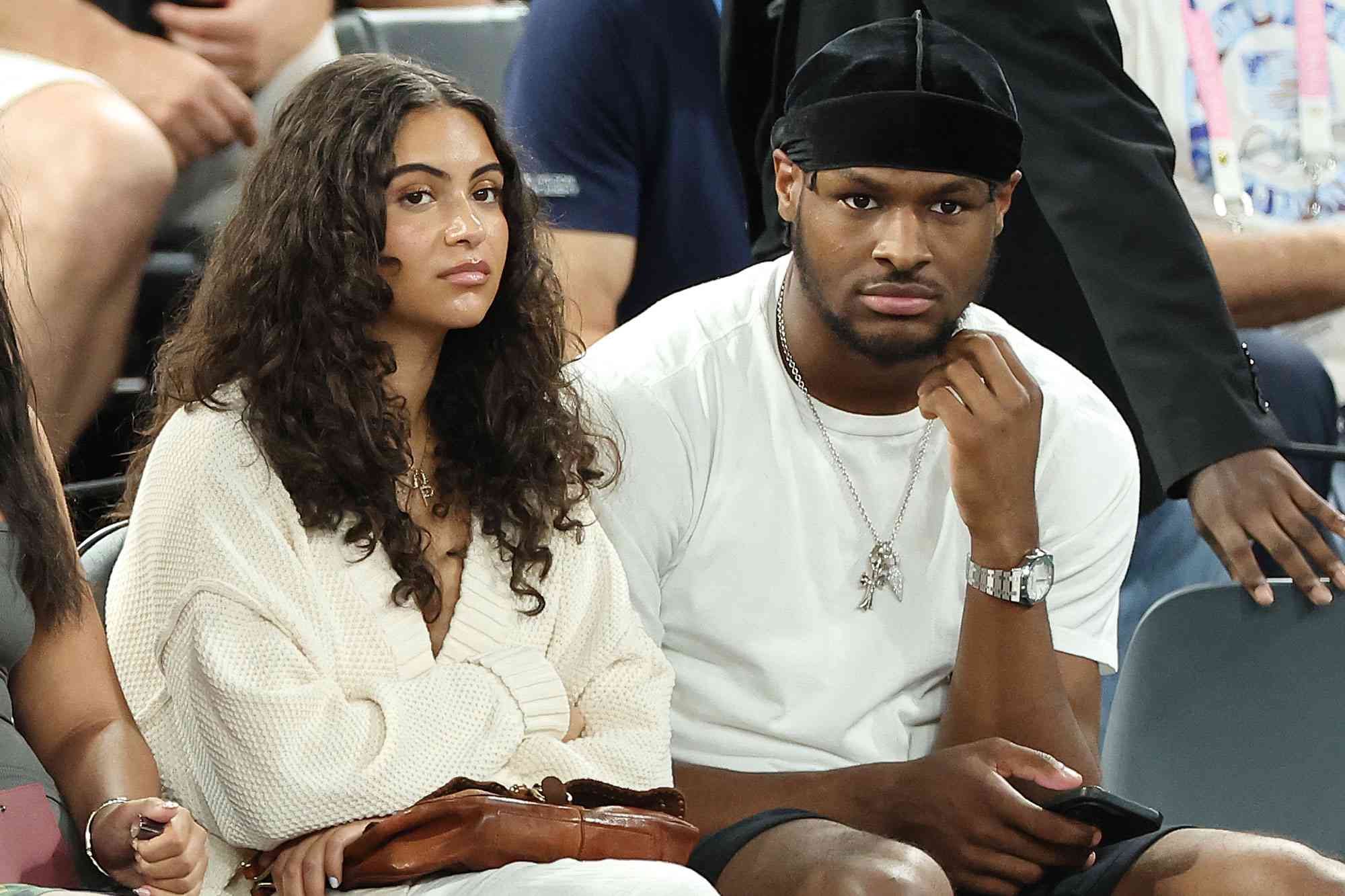 Parker Whitfield and Bronny James look on during a Men's basketball semifinals match between Team United States and Team Serbia on day thirteen of the Olympic Games Paris 2024.