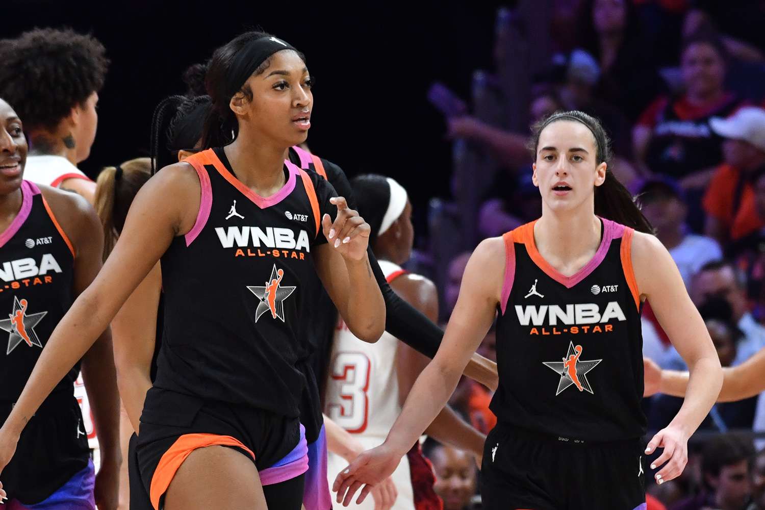 Angel Reese #5, and Caitlin Clark #22 of Team WNBA walk during the 2024 WNBA All Star Game on July 20, 2024 at Footprint Center in Phoenix, Arizona