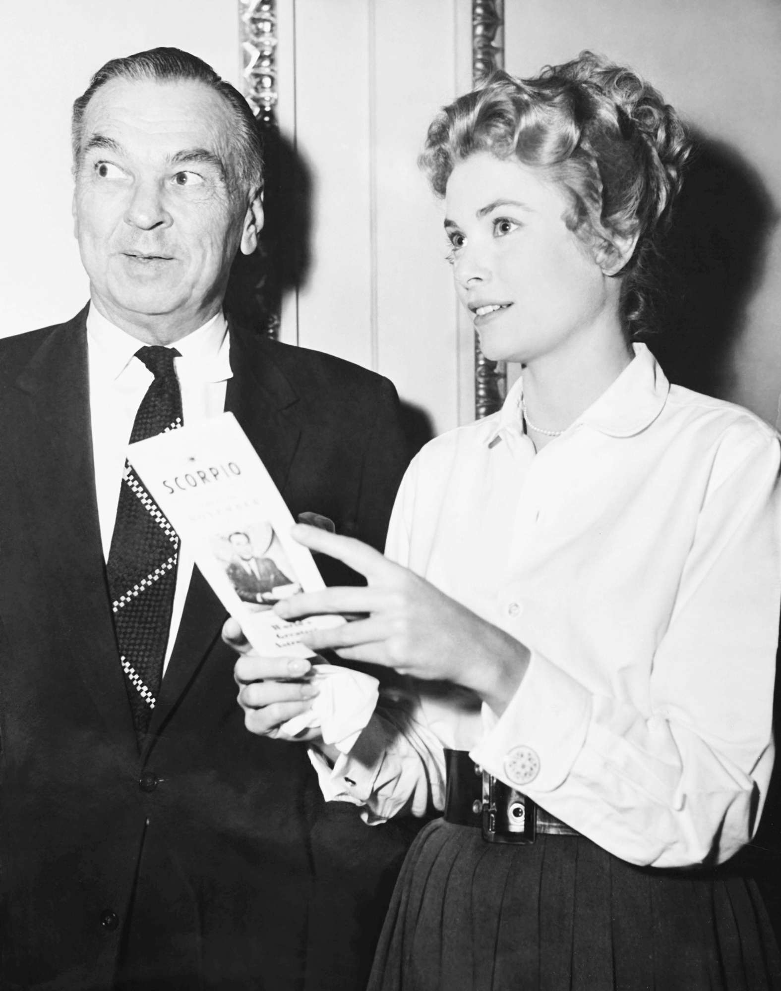 THE SWAN, from left: astrologer Carrol Righter visiting Grace Kelly on set, 1956