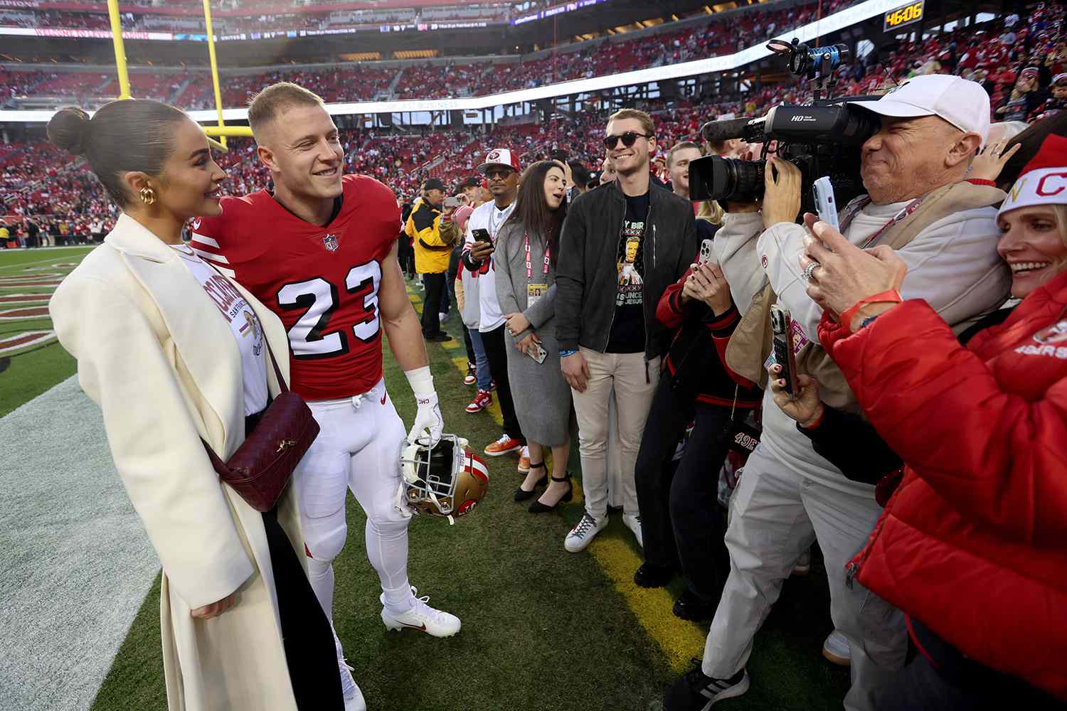 San Francisco 49ers' Christian McCaffrey #23 and his fiancÃÂ© Olivia Culpo greet fans up before their NFL game against the Baltimore Ravens at Levis Stadium