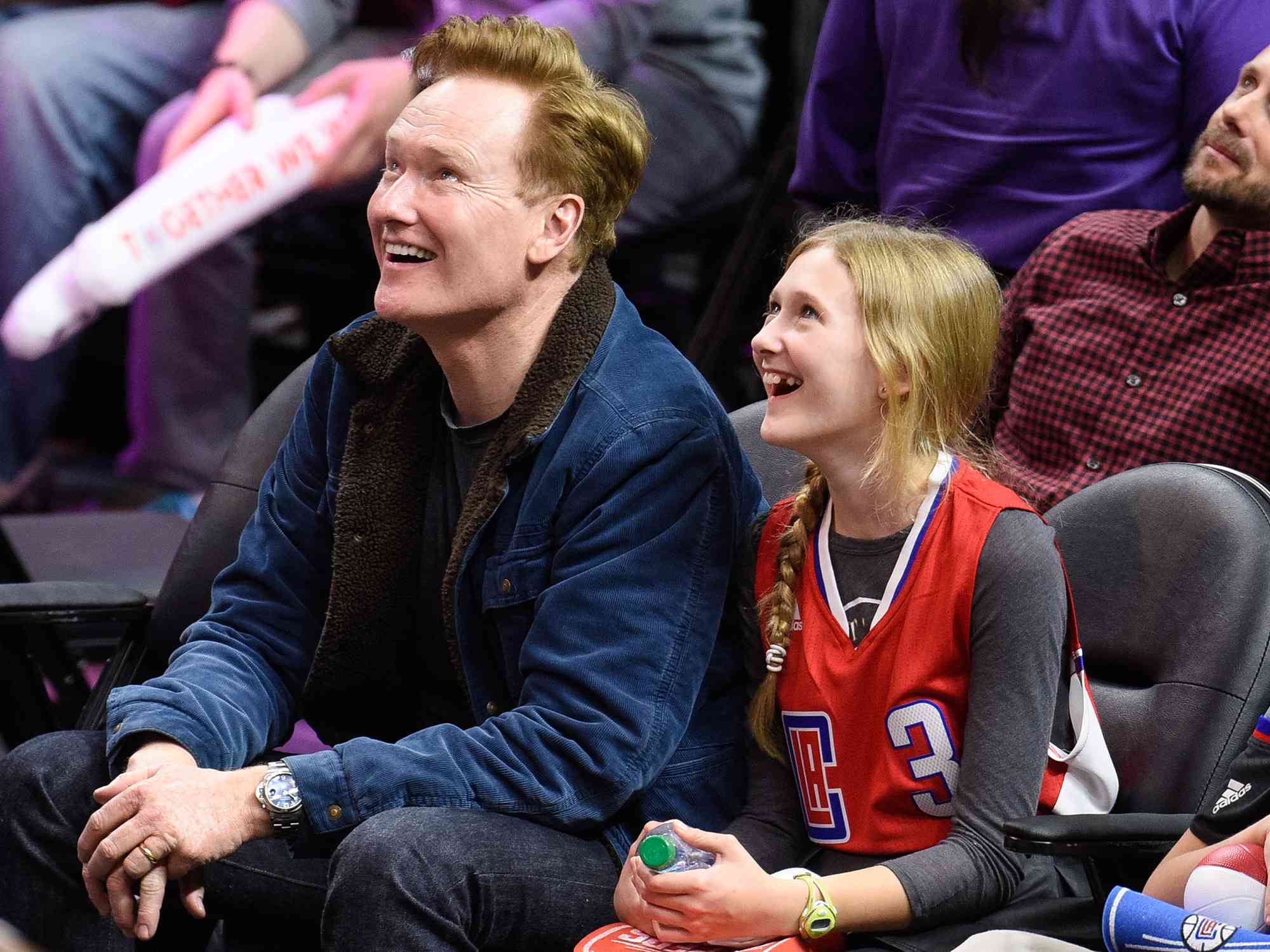 Conan O'Brien and Neve O'Brien attend a basketball game between the Houston Rockets and the Los Angeles Clippers on January 18, 2016 in Los Angeles, California. 