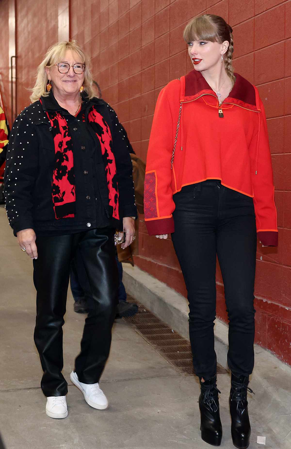 Taylor Swift walks into the stadium alongside Donna Kelce prior to the game between the Las Vegas Raiders and the Kansas City Chiefs at GEHA Field at Arrowhead Stadium on November 29, 2024 in Kansas City, Missouri. 