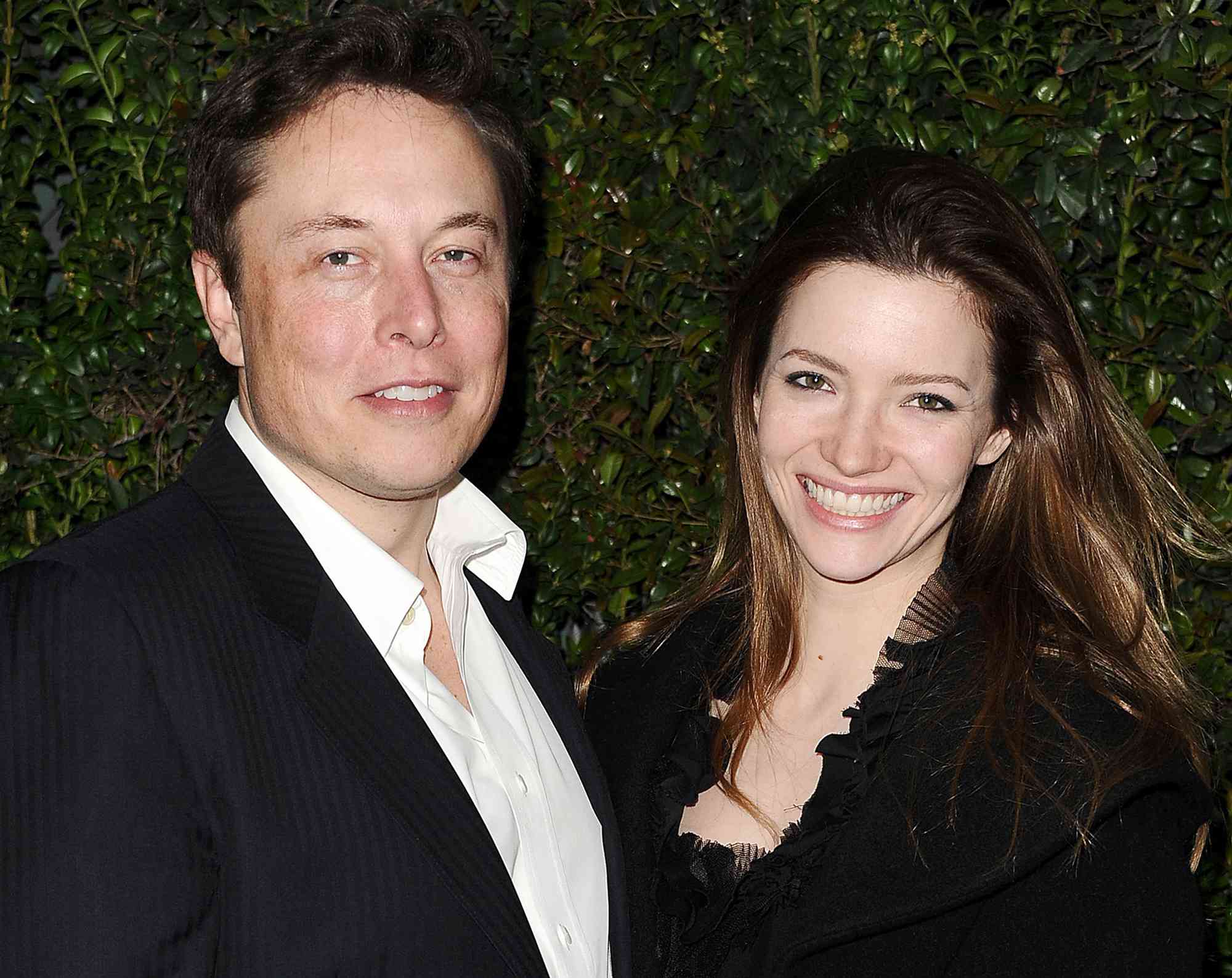 Elon Musk and Talulah Riley attend the Chanel and Charles Finch pre-Oscar dinner at Madeo Restaurant on March 1, 2014 in Los Angeles, California