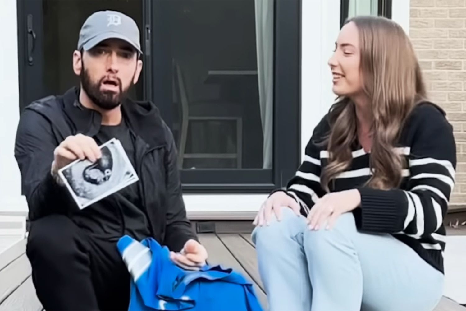 Eminem holds up daughter Hailie Jade's sonogram revealing he'll be a grandpa