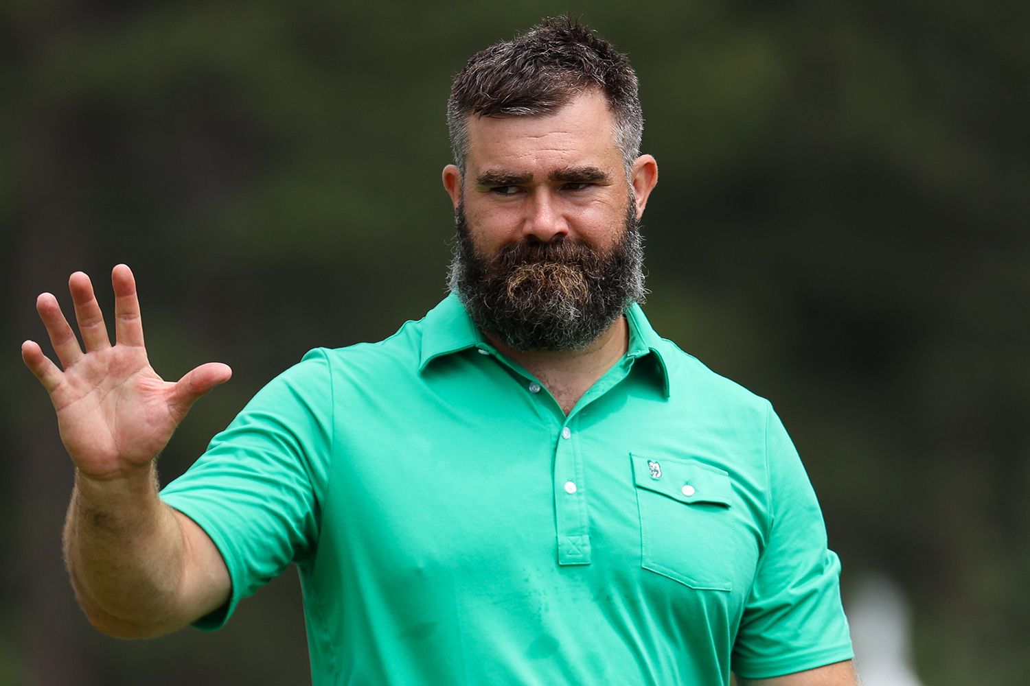 Former NFL football player Jason Kelce waves to fans at the 18th hole on day three of the 2024 American Century Championship at Edgewood Tahoe Golf Course