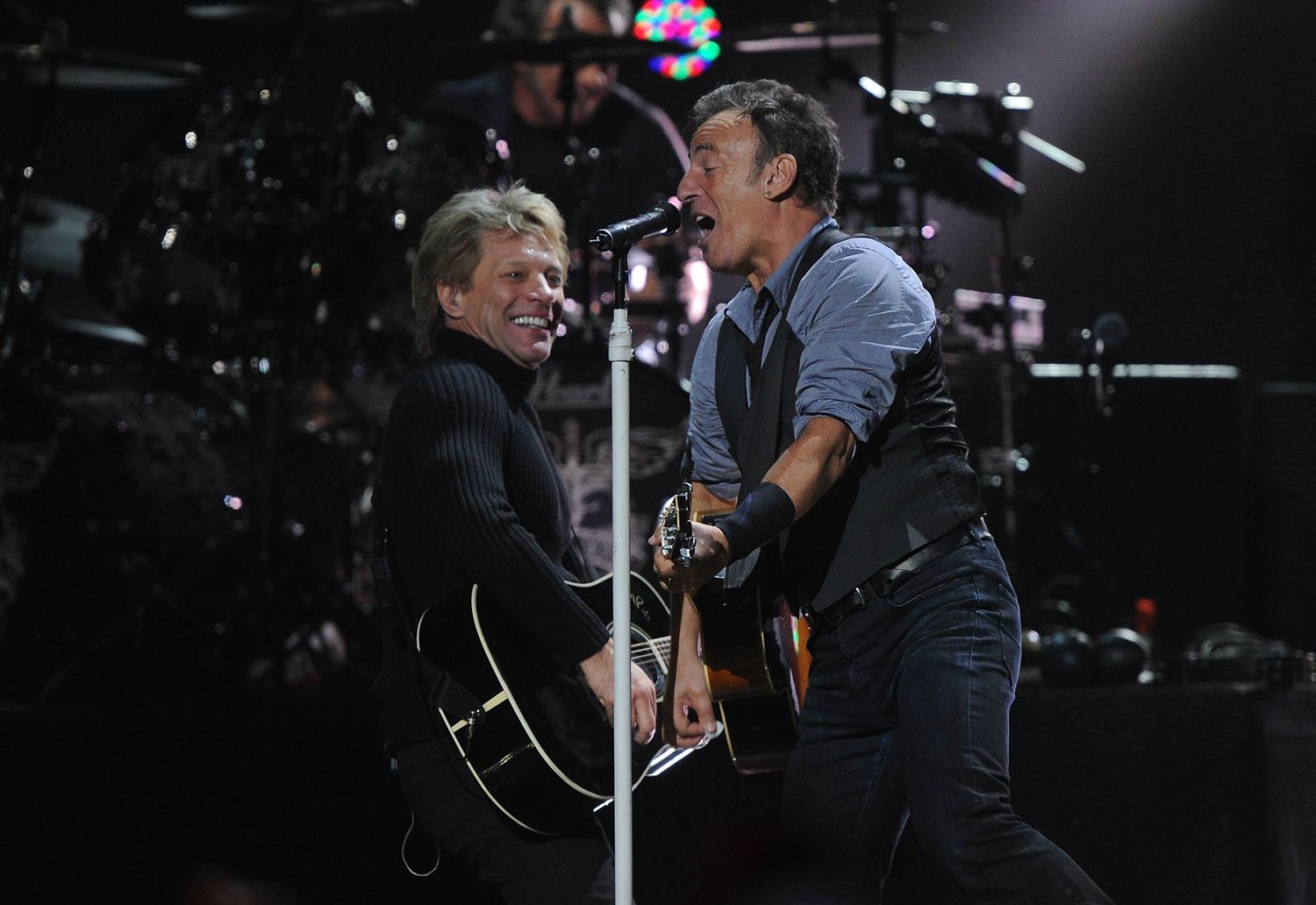  Musicians Jon Bon Jovi (L) and Bruce Springsteen perform at "12-12-12" a concert benefiting The Robin Hood Relief Fund to aid the victims of Hurricane Sandy presented by Clear Channel Media & Entertainment, The Madison Square Garden Company and The Weinstein Company at Madison Square Garden on December 12, 2012 in New York City.