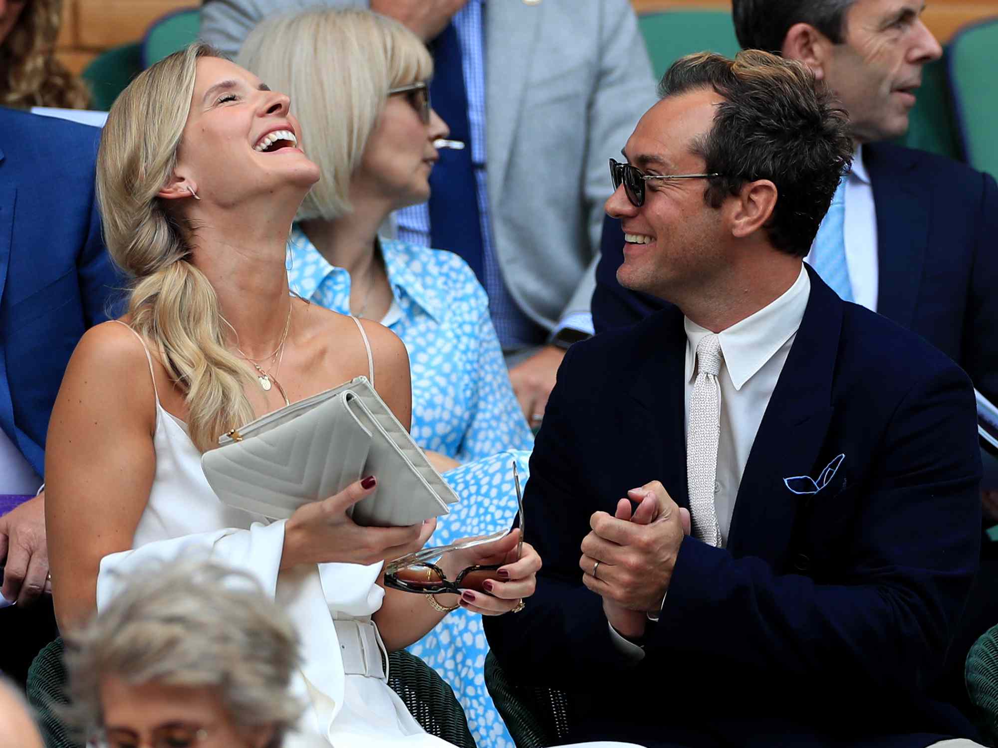 Jude Law with and his wife Phillipa on day eleven of the Wimbledon Championships at the All England Lawn Tennis and Croquet Club, Wimbledon