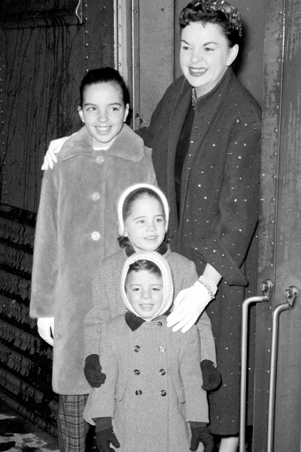 Judy Garland poses with her three children Liza, Lorna and Joey on arrival at Grand Central Station. 