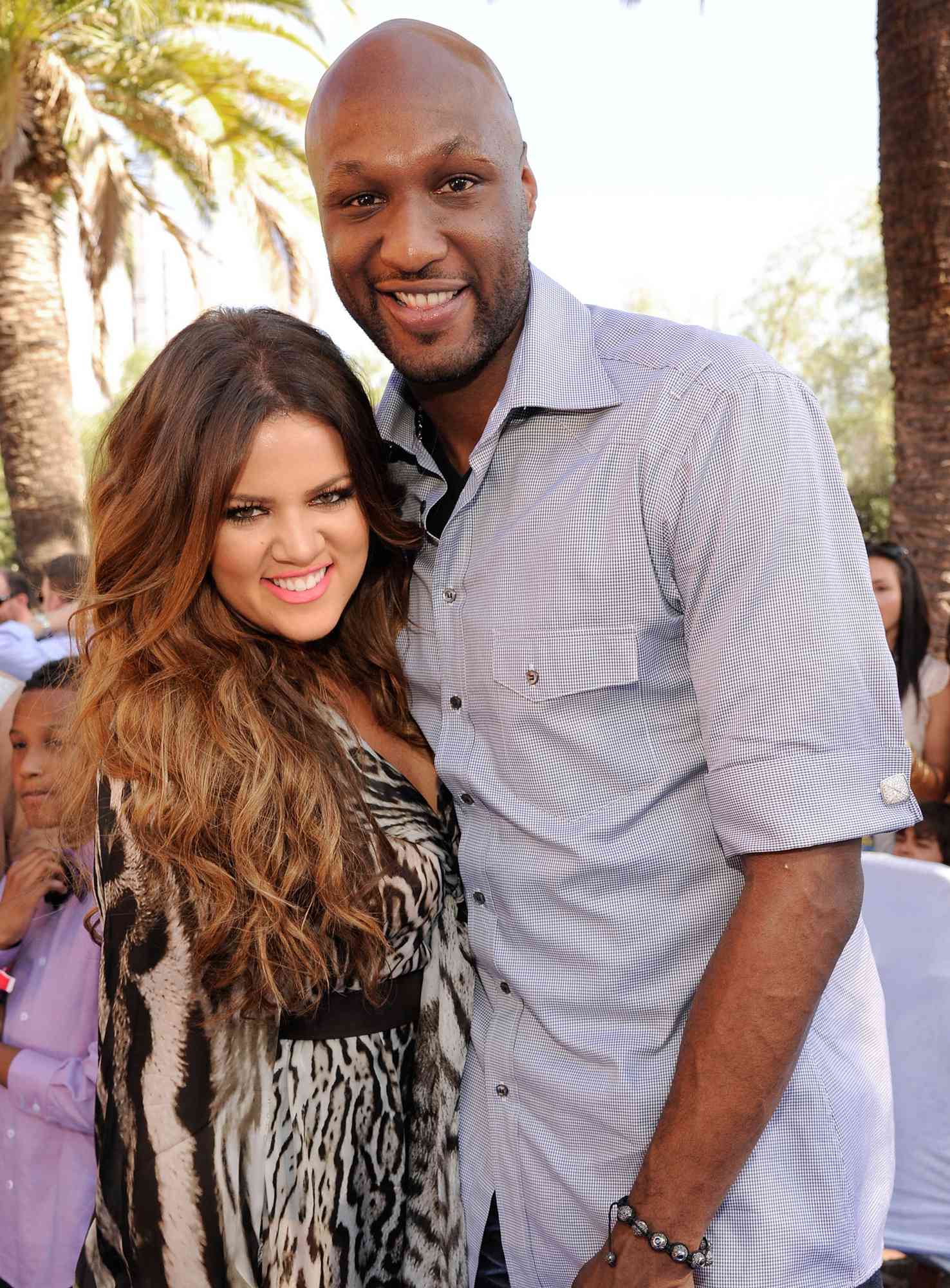 Khloe Kardashian and professional basketball player Lamar Odom arrive at the 2011 Teen Choice Awards held at the Gibson Amphitheatre on August 7, 2011 in Universal City, California.