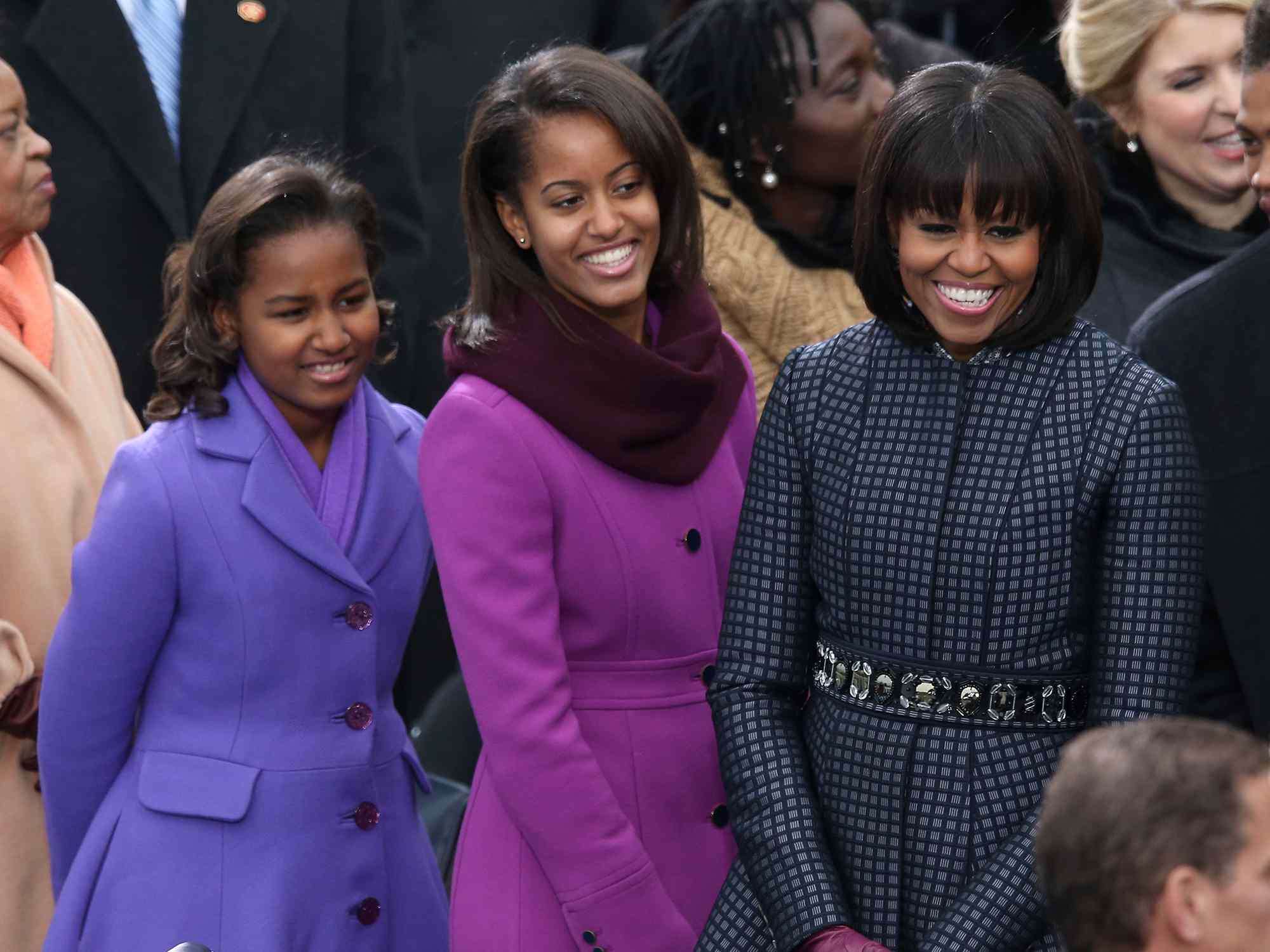 Michelle Obama and daughters, Sasha Obama and Malia Obama arrive during the presidential inauguration on the West Front of the U.S. Capitol January 21, 2013 in Washington, DC. Barack Obama was re-elected for a second term as President of the United States