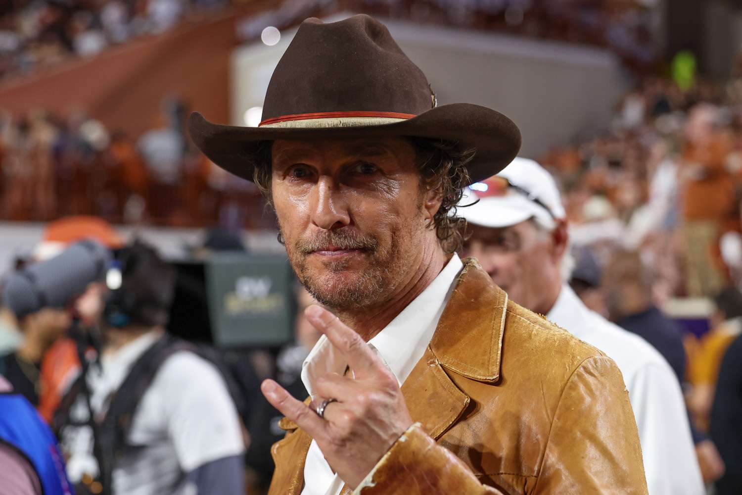 Matthew McConaughey holds up the Hook 'Em Horns sign during the SEC college football game between Texas Longhorns and Georgia Bulldogs on October 19, 2024, at Darrell K Royal - Texas Memorial Stadium in Austin, TX