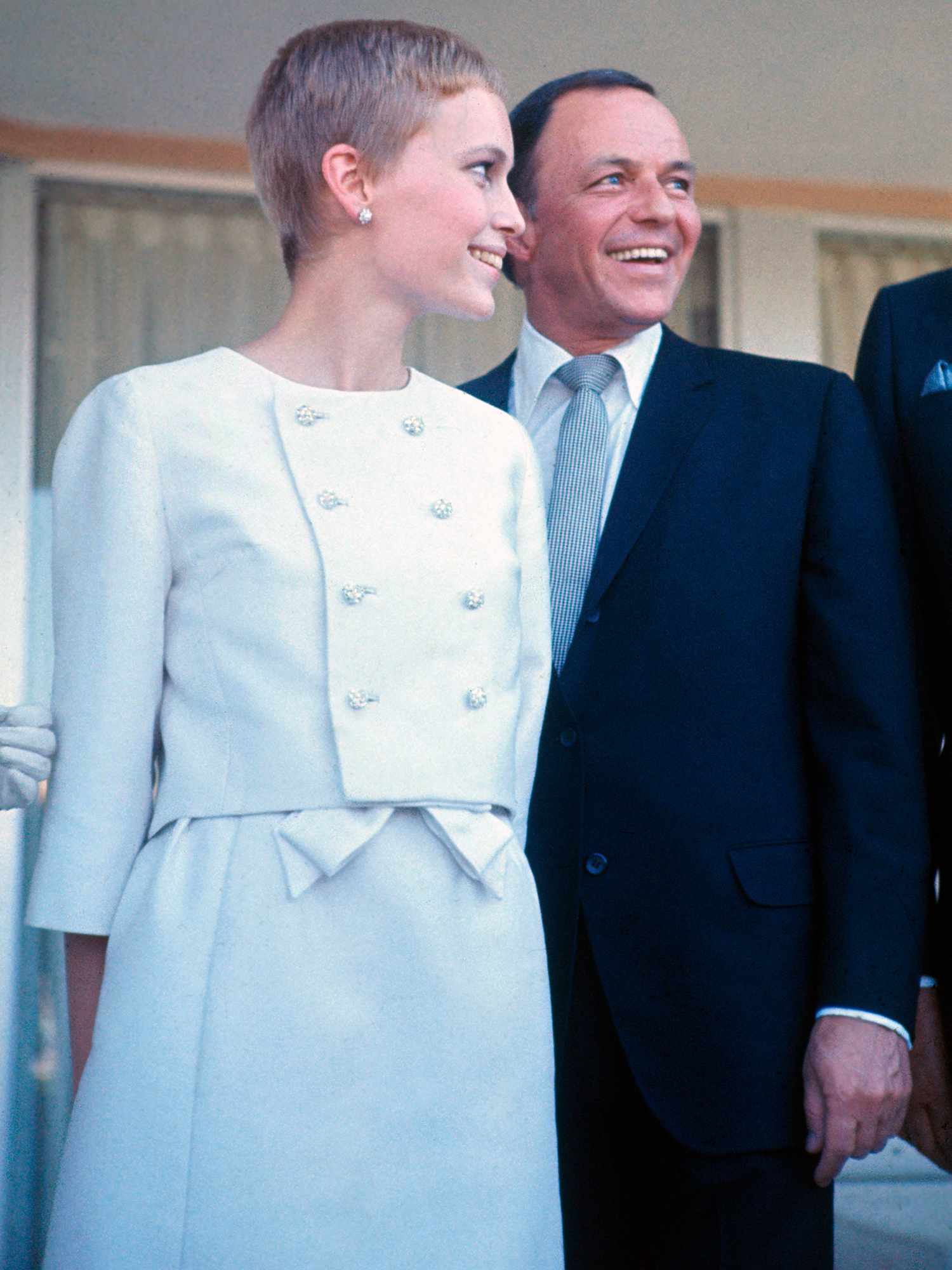  Frank Sinatra and Mia Farrow following their wedding on July 19, 1966.