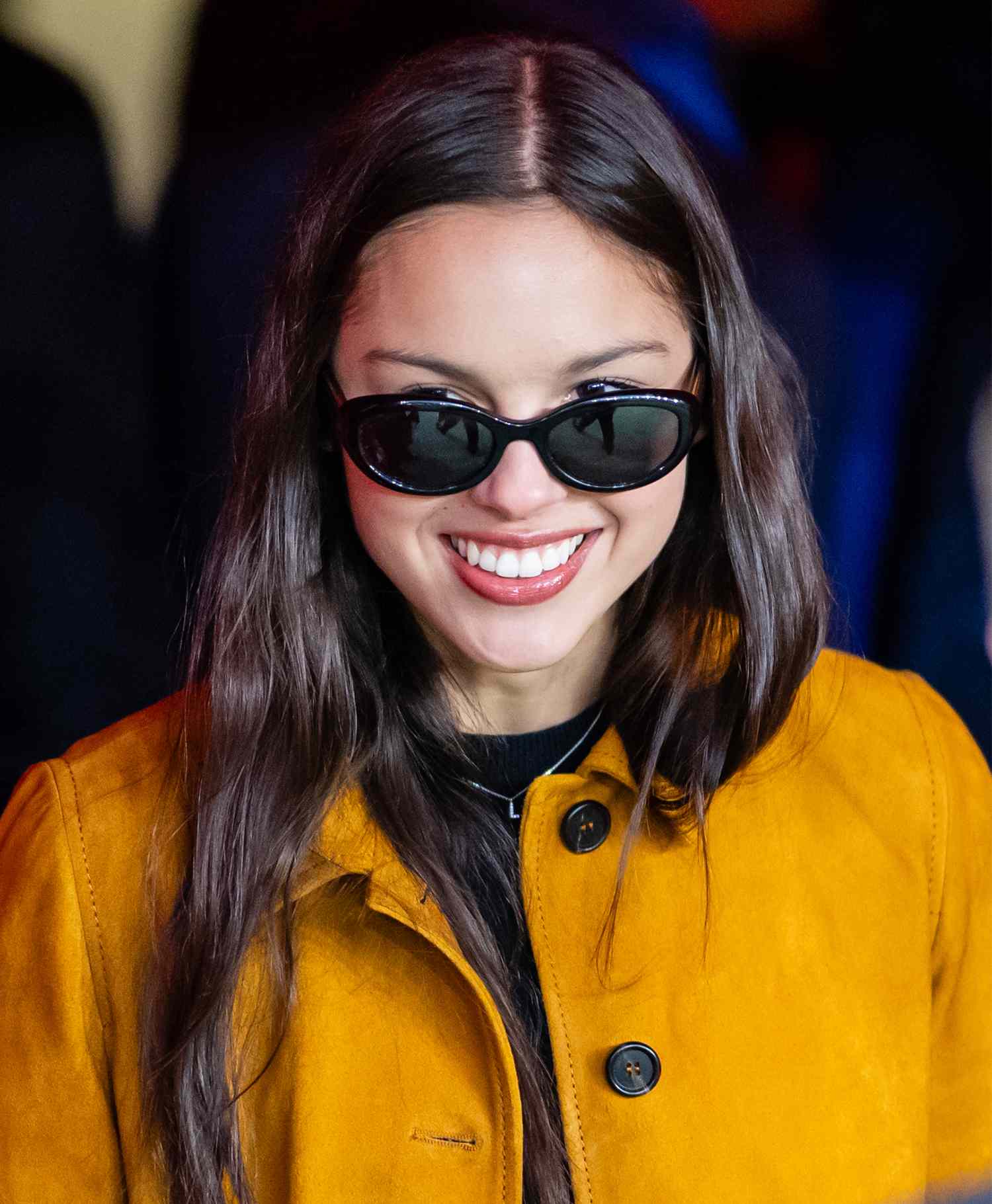 Olivia Rodrigo watches the warm up ahead of the Premier League match between Manchester United FC and Chelsea FC at Old Trafford on November 03, 2024 in Manchester