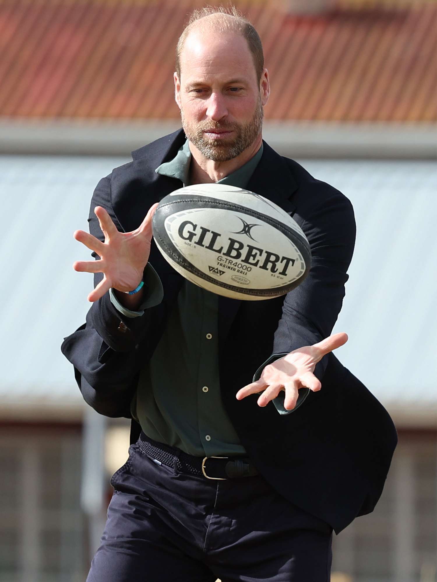 Prince William, Prince of Wales takes part in a rugby coaching session with local school children during a visit to Ocean View Secondary School on November 4, 2024 in Cape Town