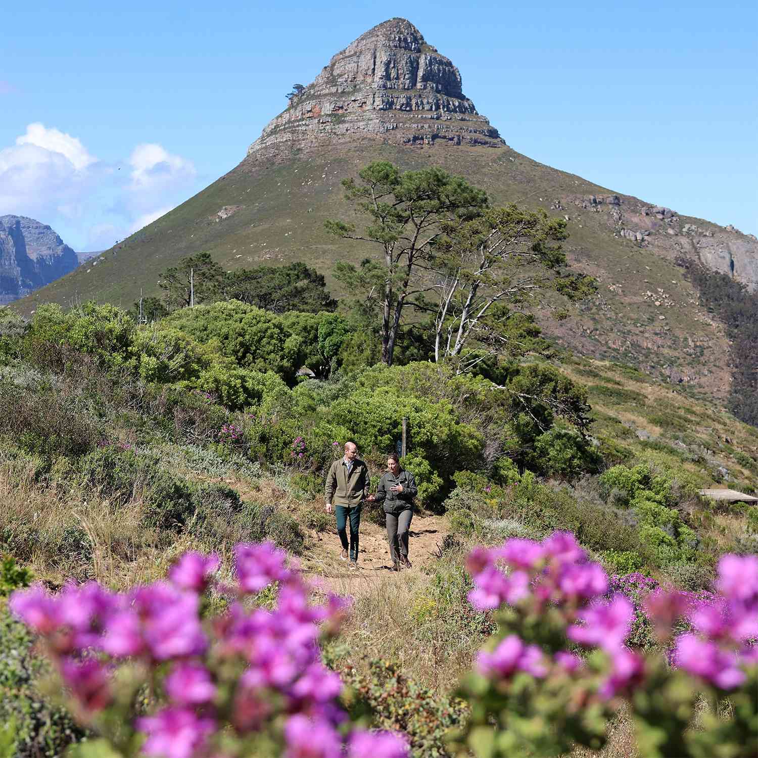 Prince William, Prince of Wales talks to Megan Taplin, Park Manager for Table Mountain National Park during his visit at Signal Hill on November 05, 2024 in Cape Town, South Africa